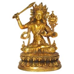 Tibetischer Buddha-Manjushree aus vergoldeter Bronze mit Perlenquasten