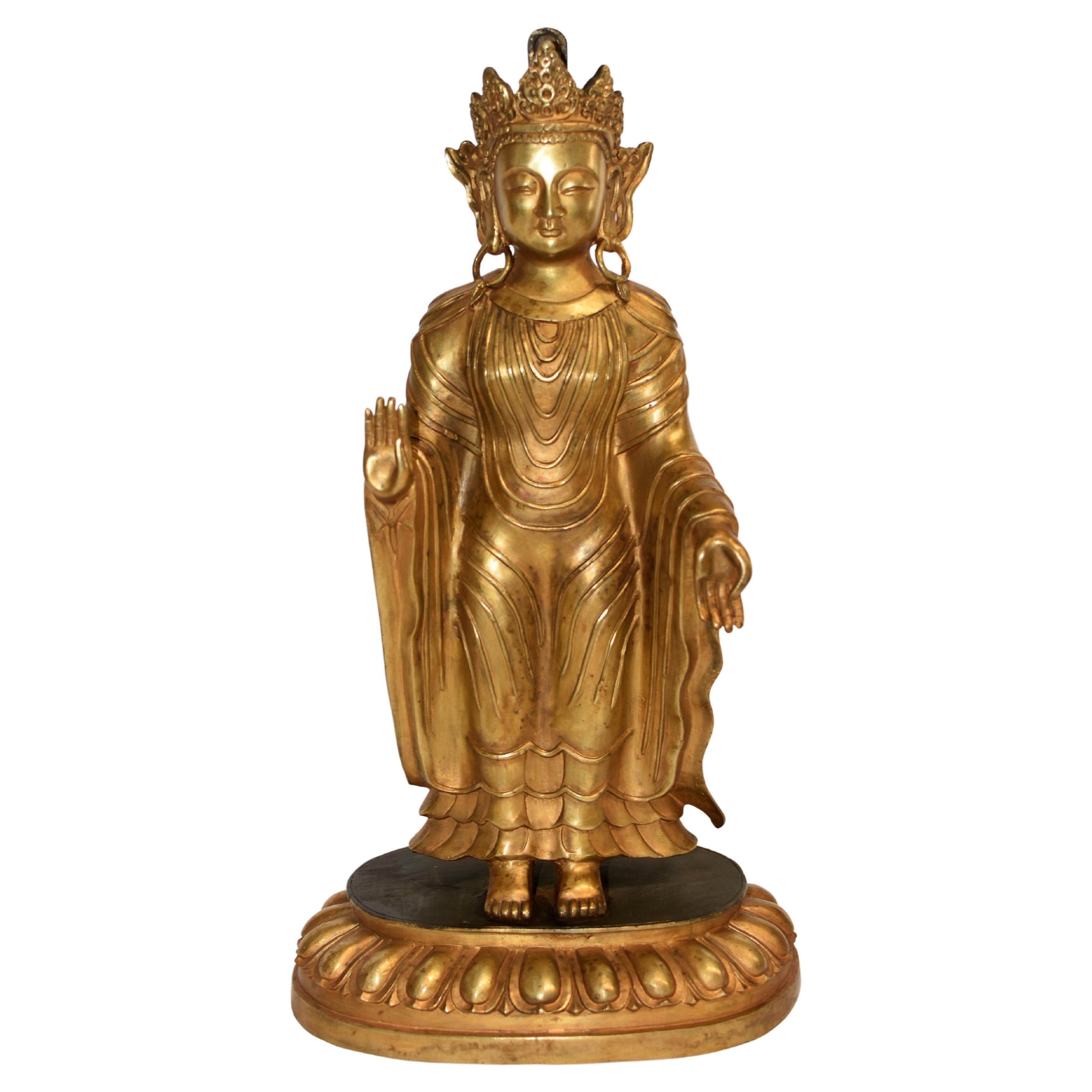 A large, 11 lb, gilt bronze Tibetan Buddha statue of superb quality. Standing on lotus plinth with the 