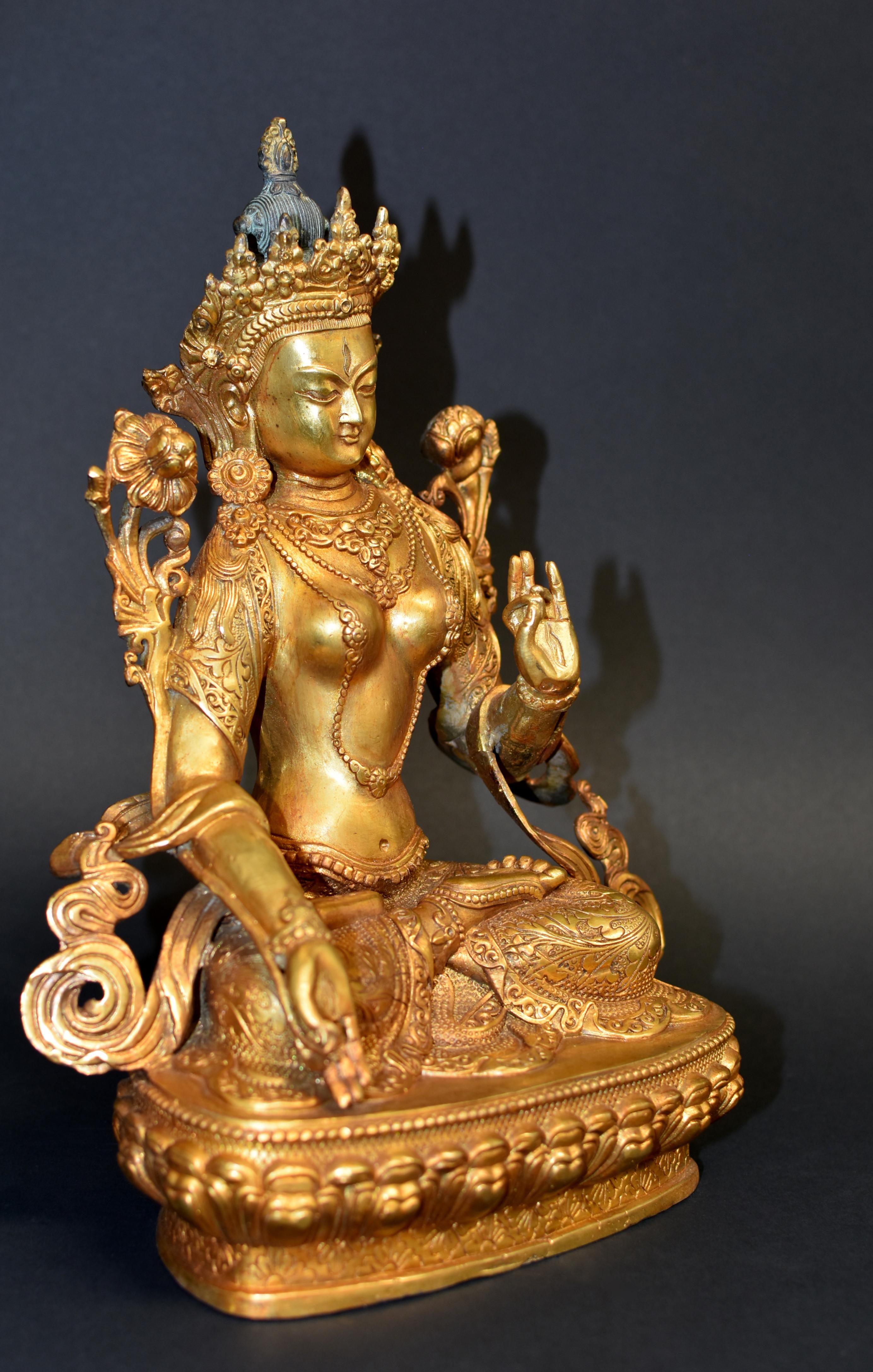 A beautiful 7.6 lb statue of Tibetan Bodhisattva White Tara. The White Tara is regarded as the consort of Avalokiteswara, the Goddess of Great Compassion. Seated in full vajra posture, her right hand in boon conferring mudra while the left hand in