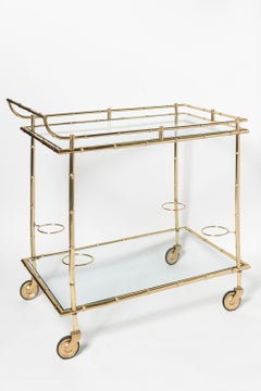 Gilt cast bronze and glass bar cart. France, circa 1950.
