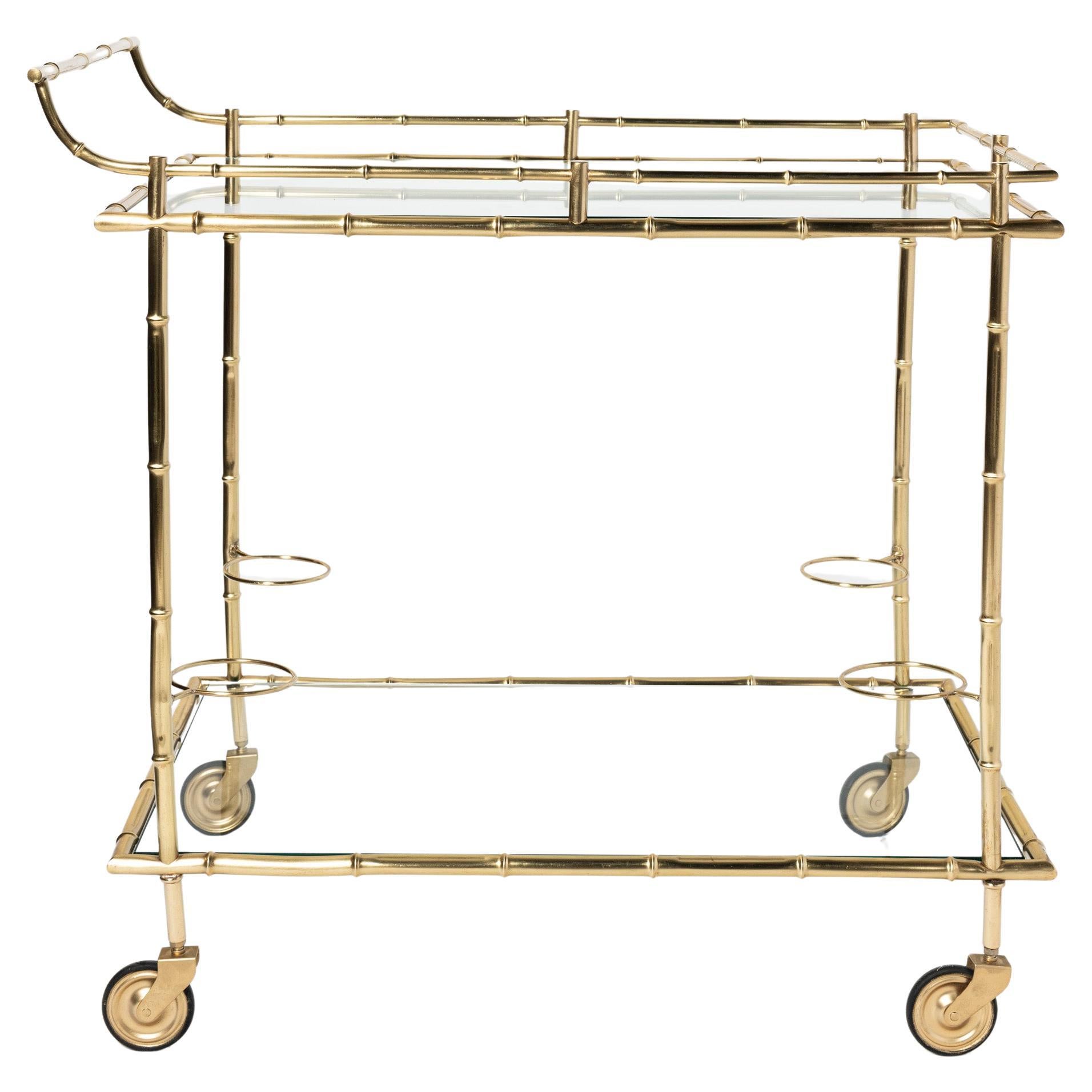 Carrito de bar de bronce fundido dorado y cristal. Francia, hacia 1950.