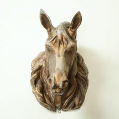 Tête de cheval en métal moulé doré