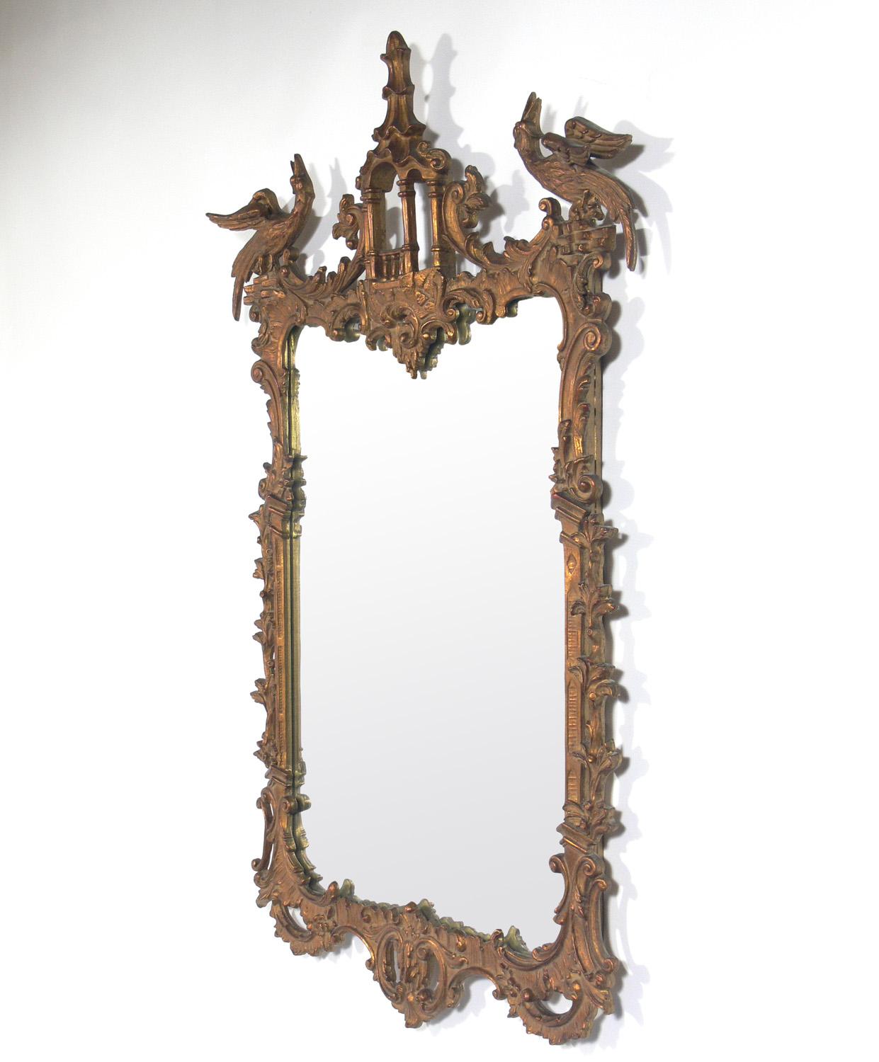 Chinese Chippendale or chinoiserie mirror, American, circa 1940s. It is constructed of gilt wood and gesso. Wonderful original patina to the gilt surfaces and the mirror.