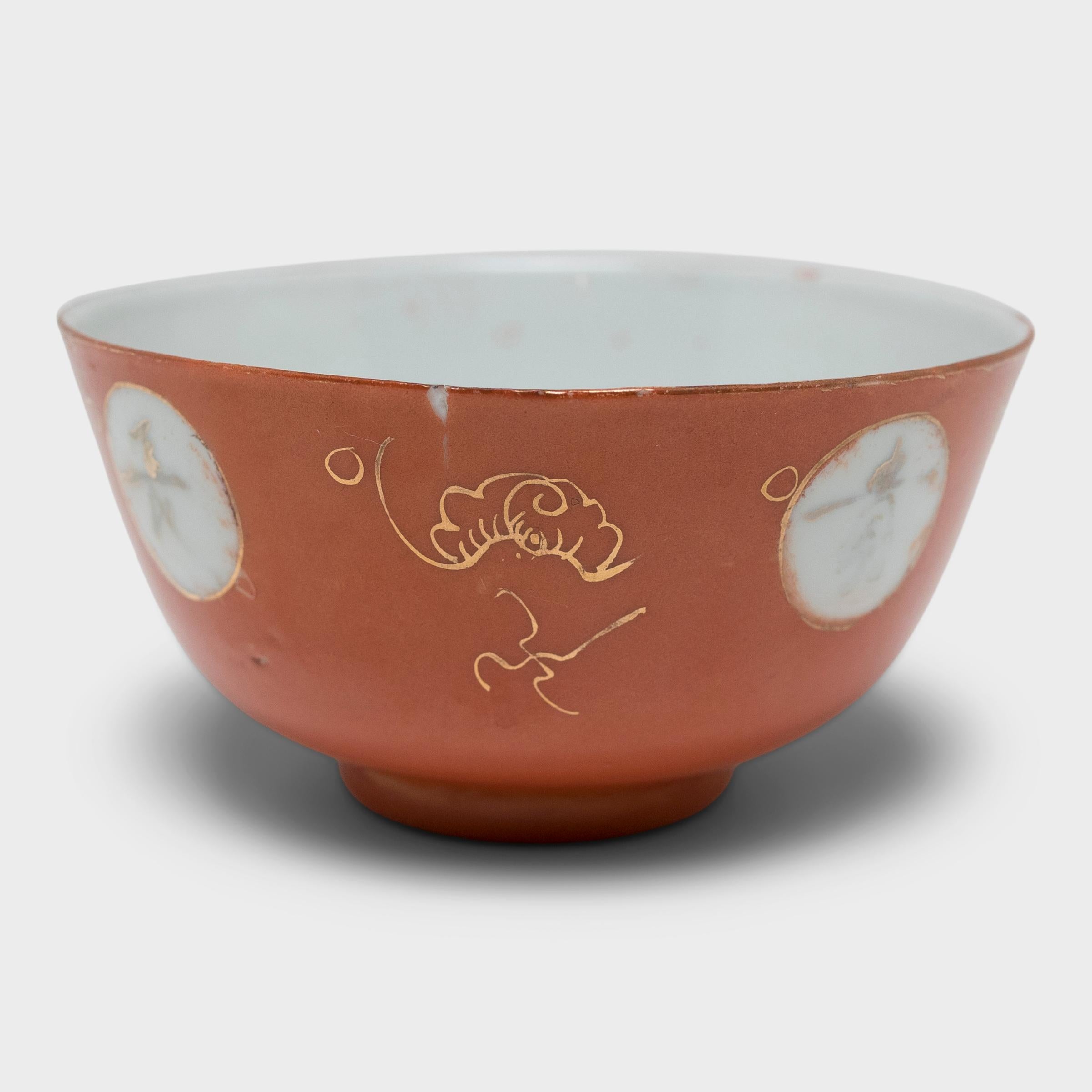 Dated to the Republic period (1912-1949), this bowl is beautifully decorated with a rich, persimmon-orange glaze accented by gilt brushwork. Wrapped around the center of the bowl are four medallions enclosing Chinese calligraphy. Gilt embellishments