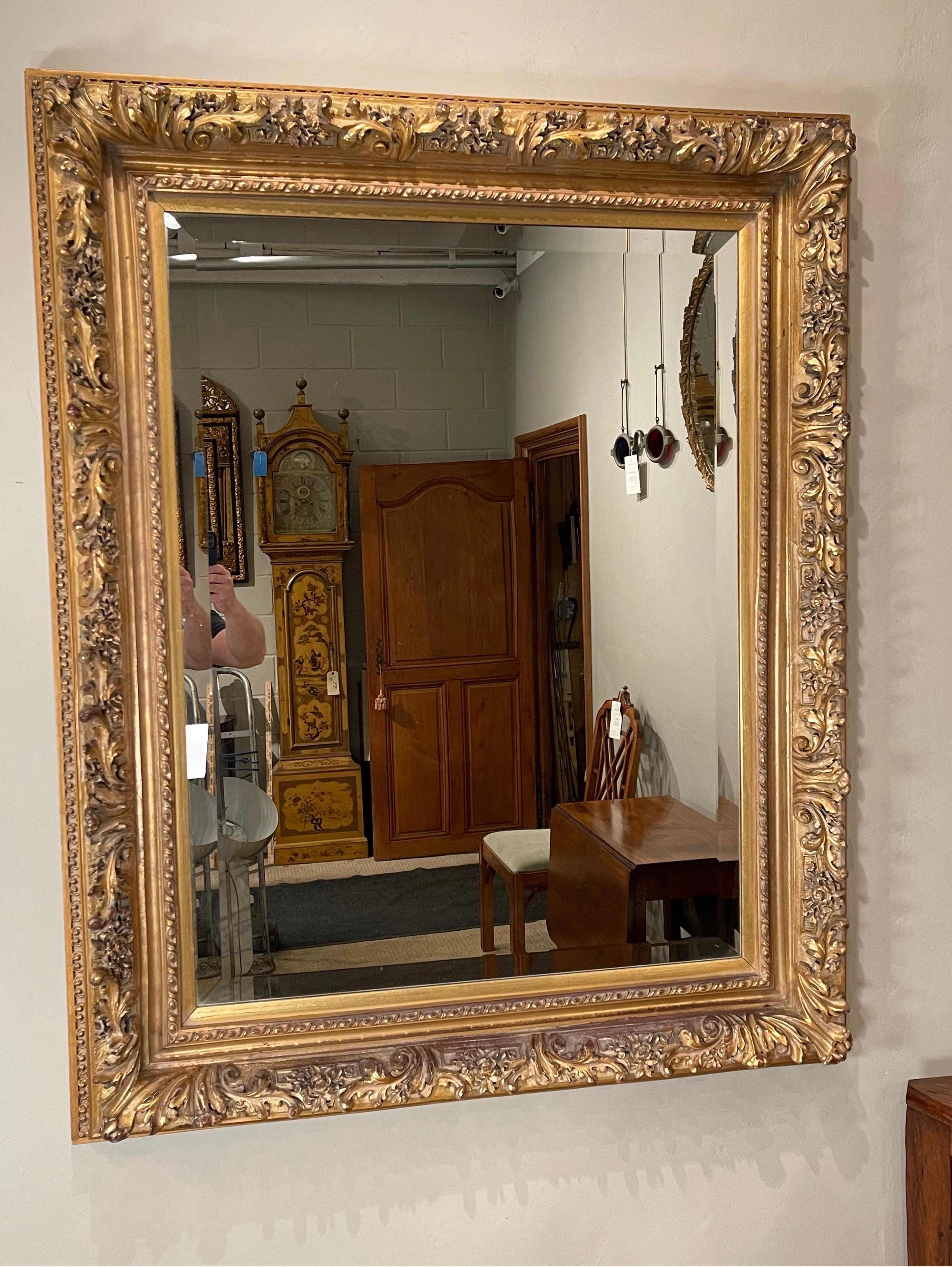 Rectangular Gilt-composition mirror with beveled mirror plate 
Can be hung “portrait”or”landscape” style has hangers for both perspectives.
