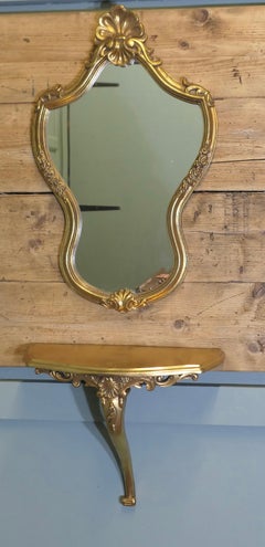 Gilt Console Mirror with Shelf  This is a very lovely piece