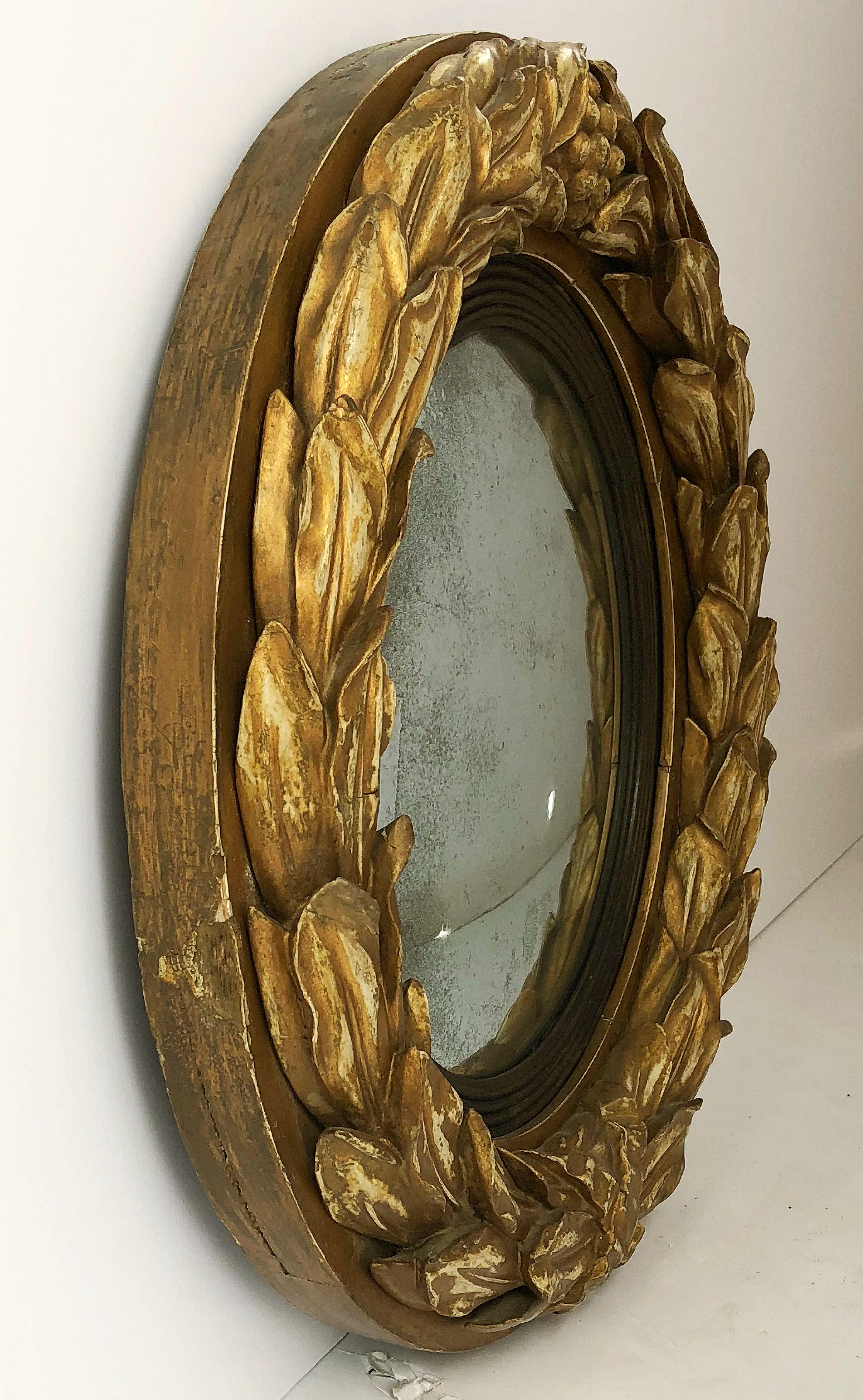An English gilt convex mirror (19 1/2