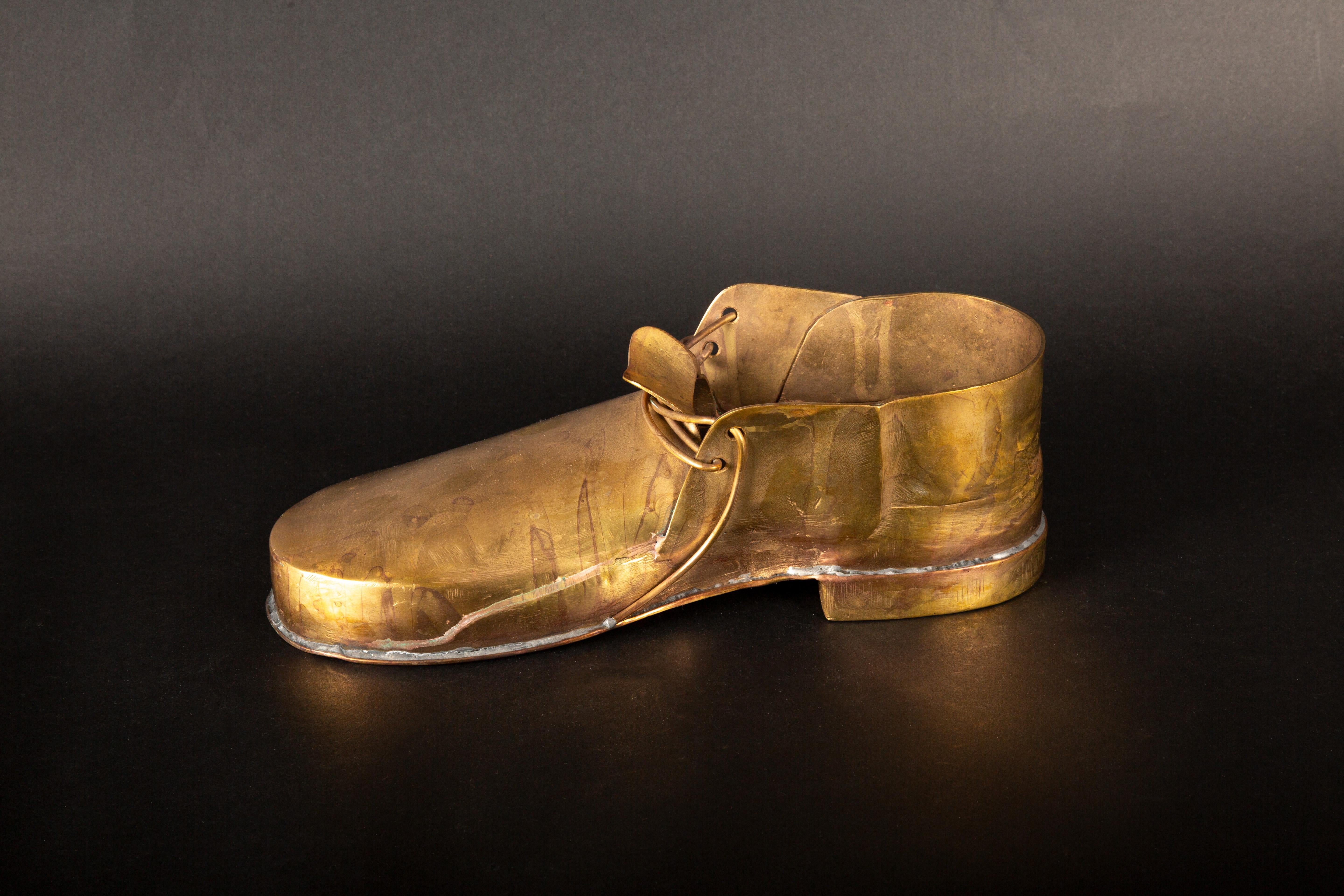 Gilt Copper Shoe in the Shape of a Loafer with Gilt copper lace.

Measures 12
