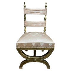 Gilt curule chair and silk