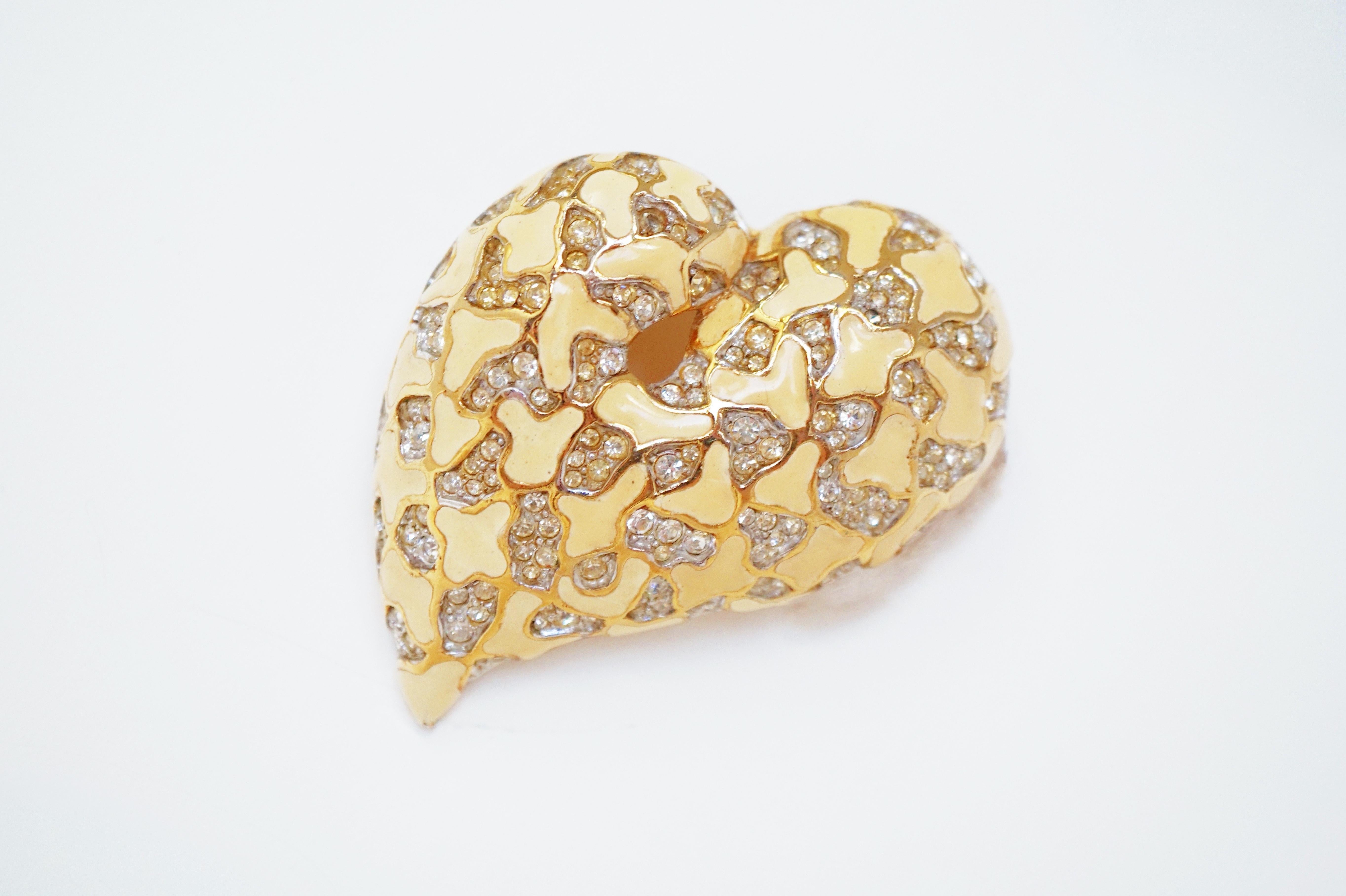 This beautiful and extremely rare three dimensional heart brooch by Jomaz, circa 1960, is a wonderful addition to a high end vintage costume jewelry collection and a gorgeous way to dress up any look!  Featuring high end Austrian crystals, gold