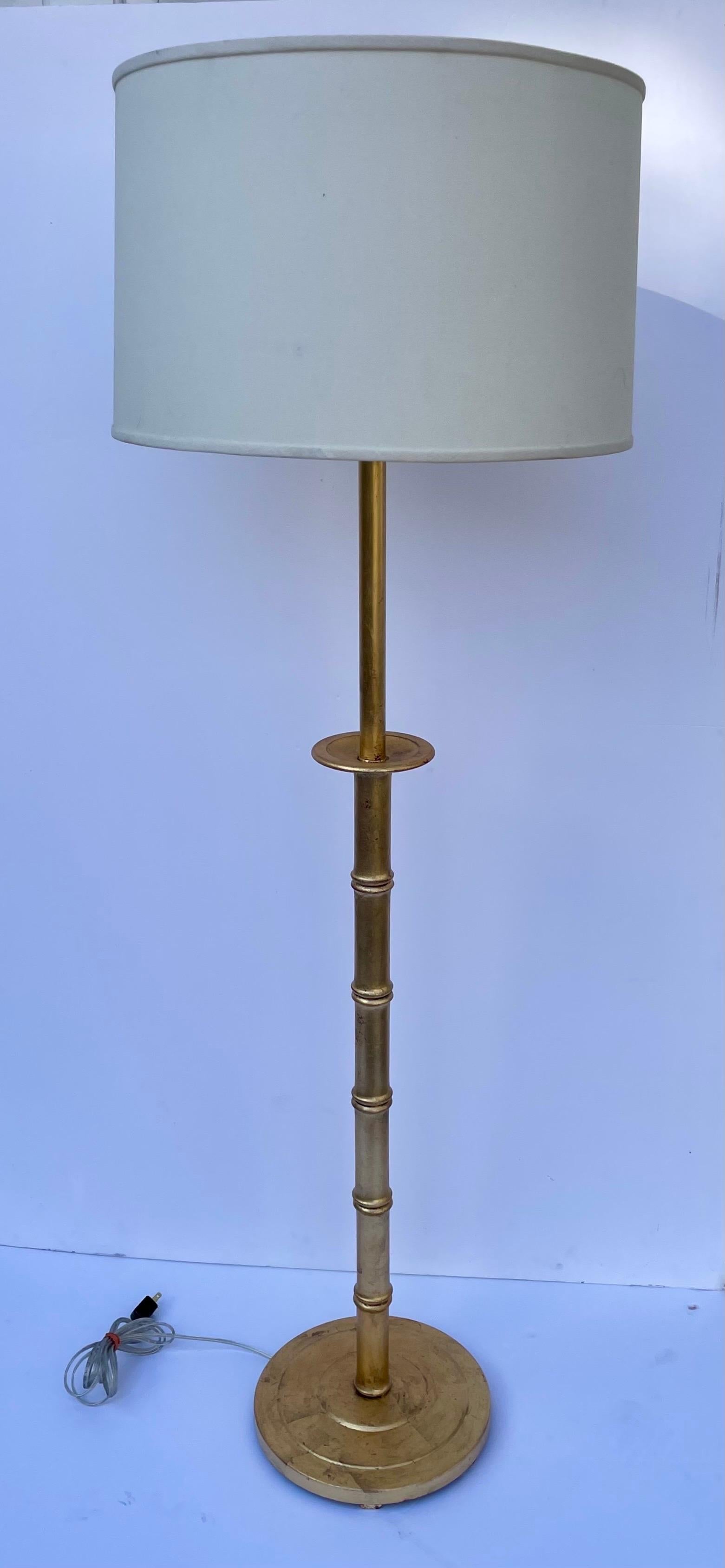 Gilt Faux Bamboo Floor Lamp in the Hollywood Regency Style. Made of metal and wood. 48