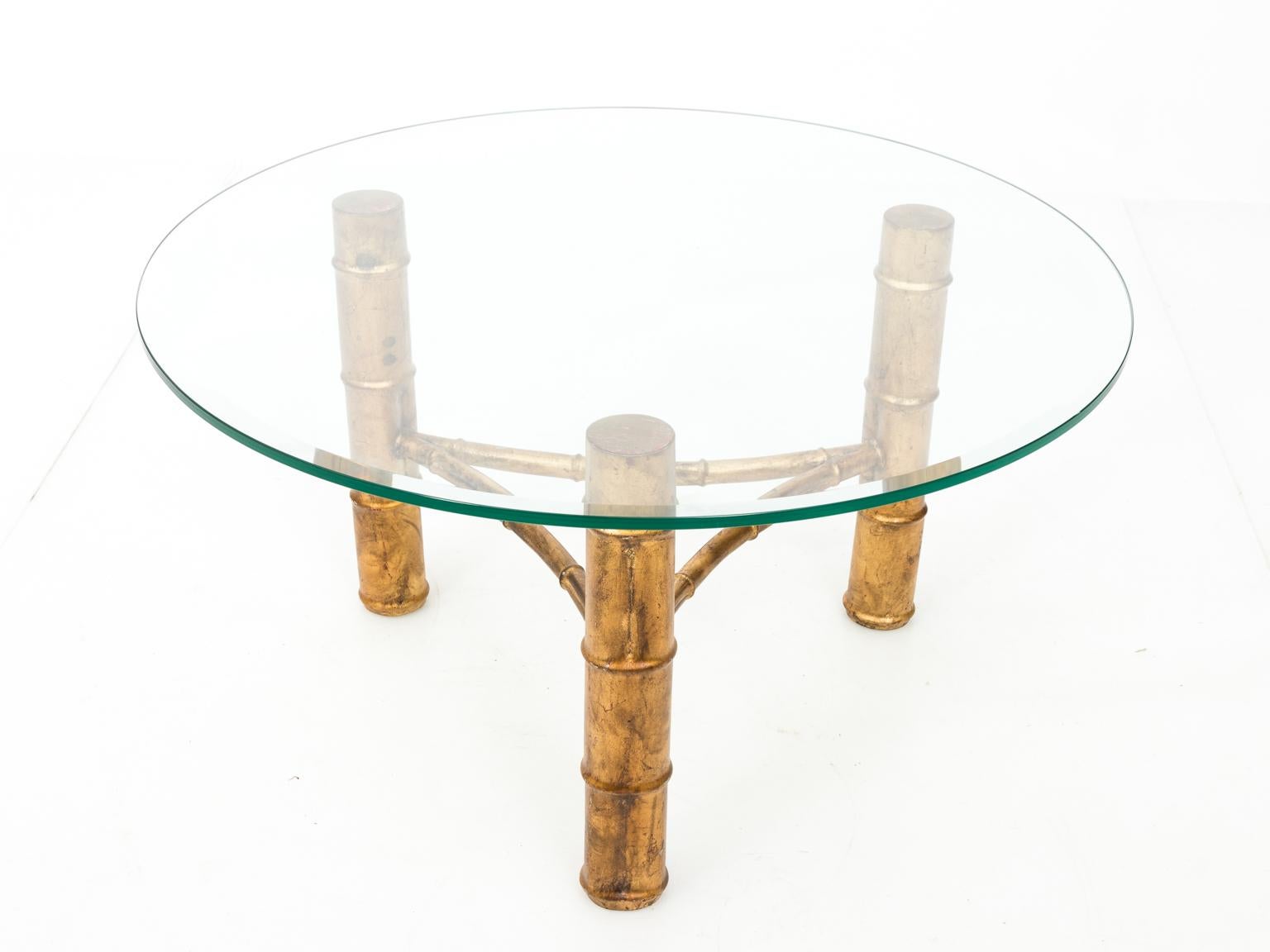 Gilt metal faux bamboo round coffee table with new 36.00 Inch glass top, circa mid-20th century. Please note of minor wear to the gilt finish. This piece weighs between 40 and 70 LBS.
 
