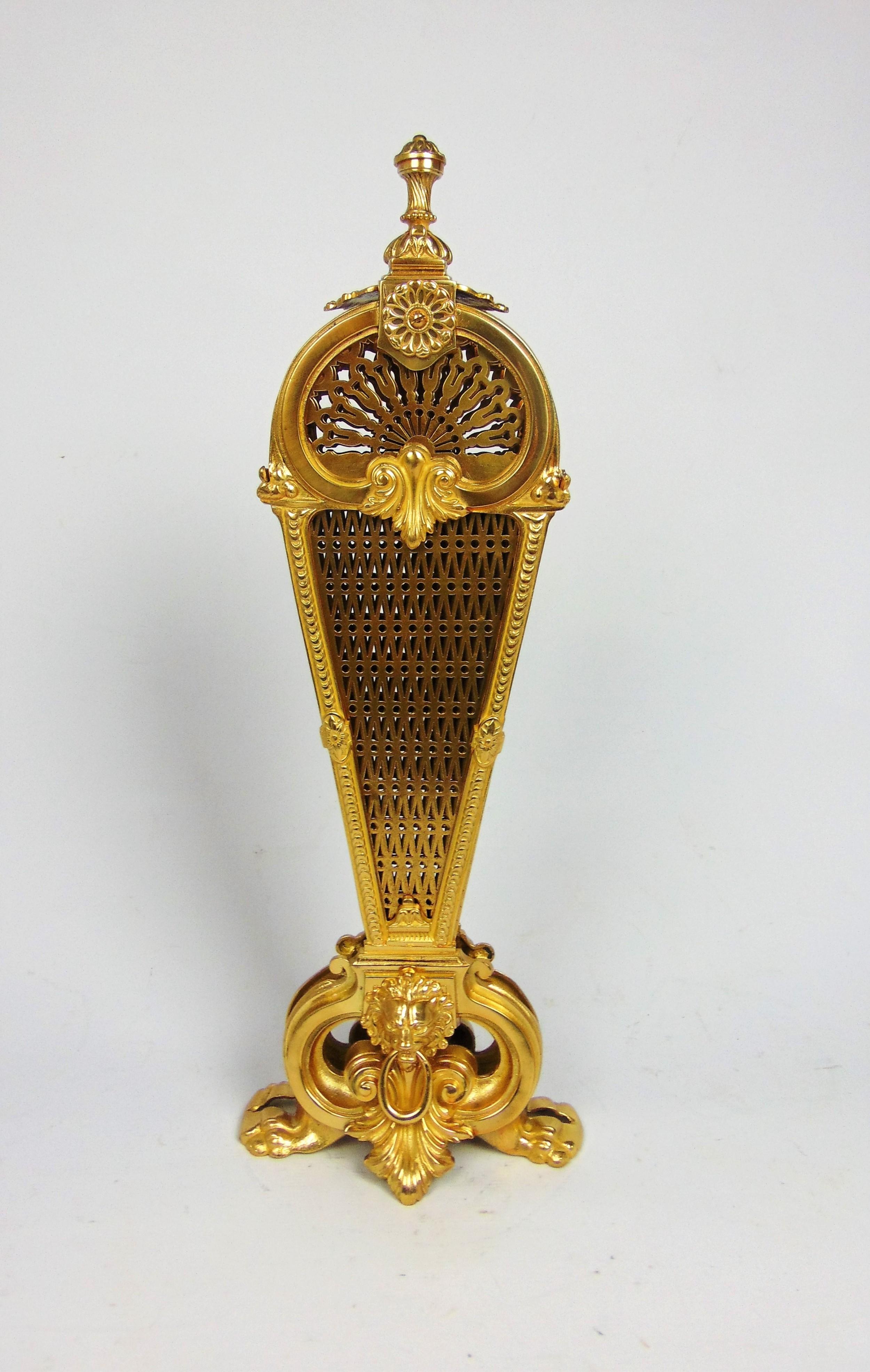 Antique Spark Guard French Gilt Bronze Fire Peacock Screen with cast Lions head and Paw feet the centre section un locks to release eight radiating pierced fan acting as a most decorative screen.
A quality and most attractive gilded Peacock Fire