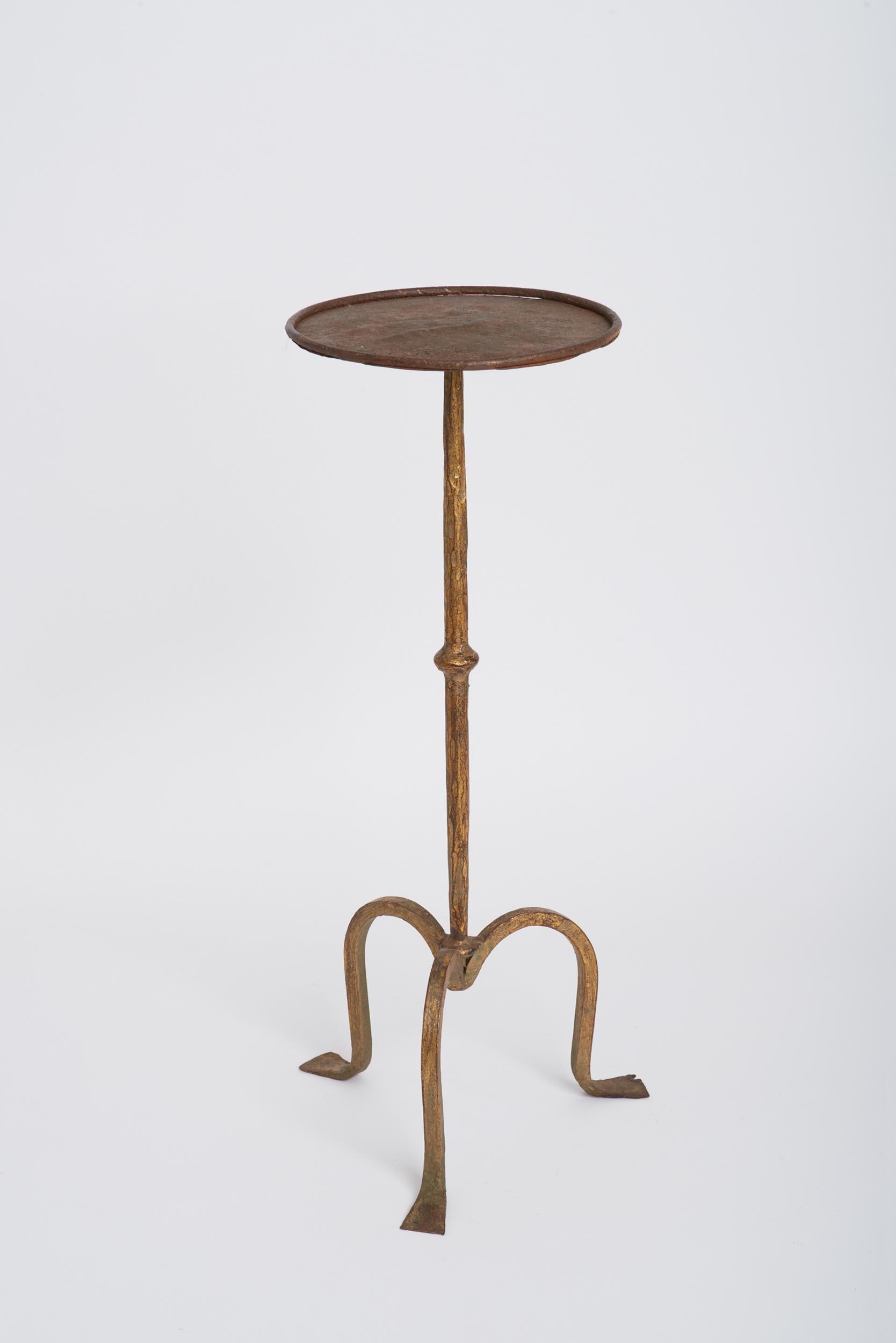 A forged and gilt iron martini table.
Spain, mid 20th Century. 