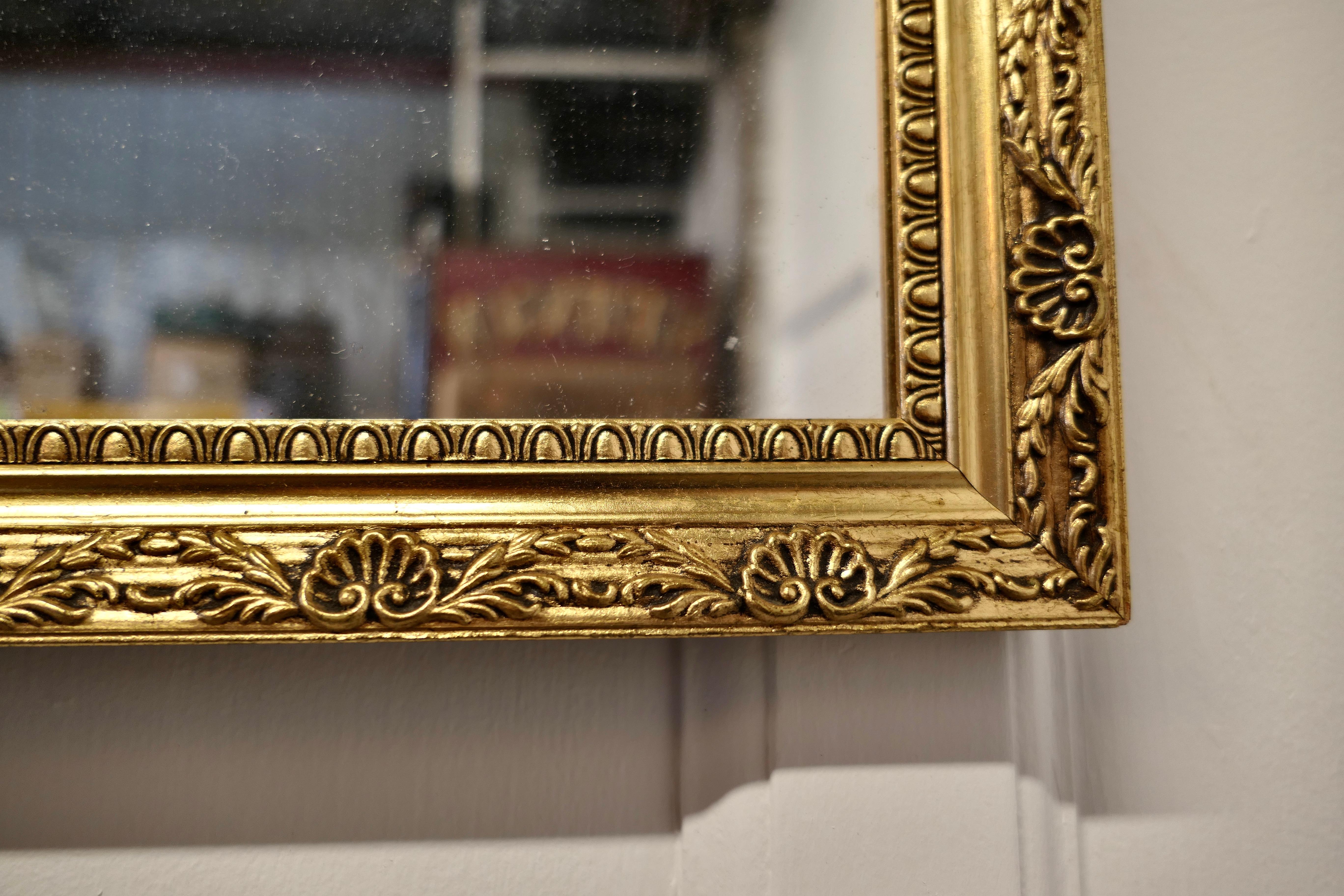 Giltwood Gilt Frame Long Wall Mirror This is a Charming and Elegant Piece For Sale