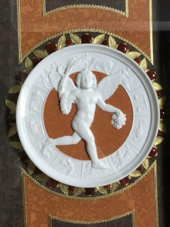 Plaque biscuit Svres encadrée et dorée avec cabochons cornéens et montures en bronze doré