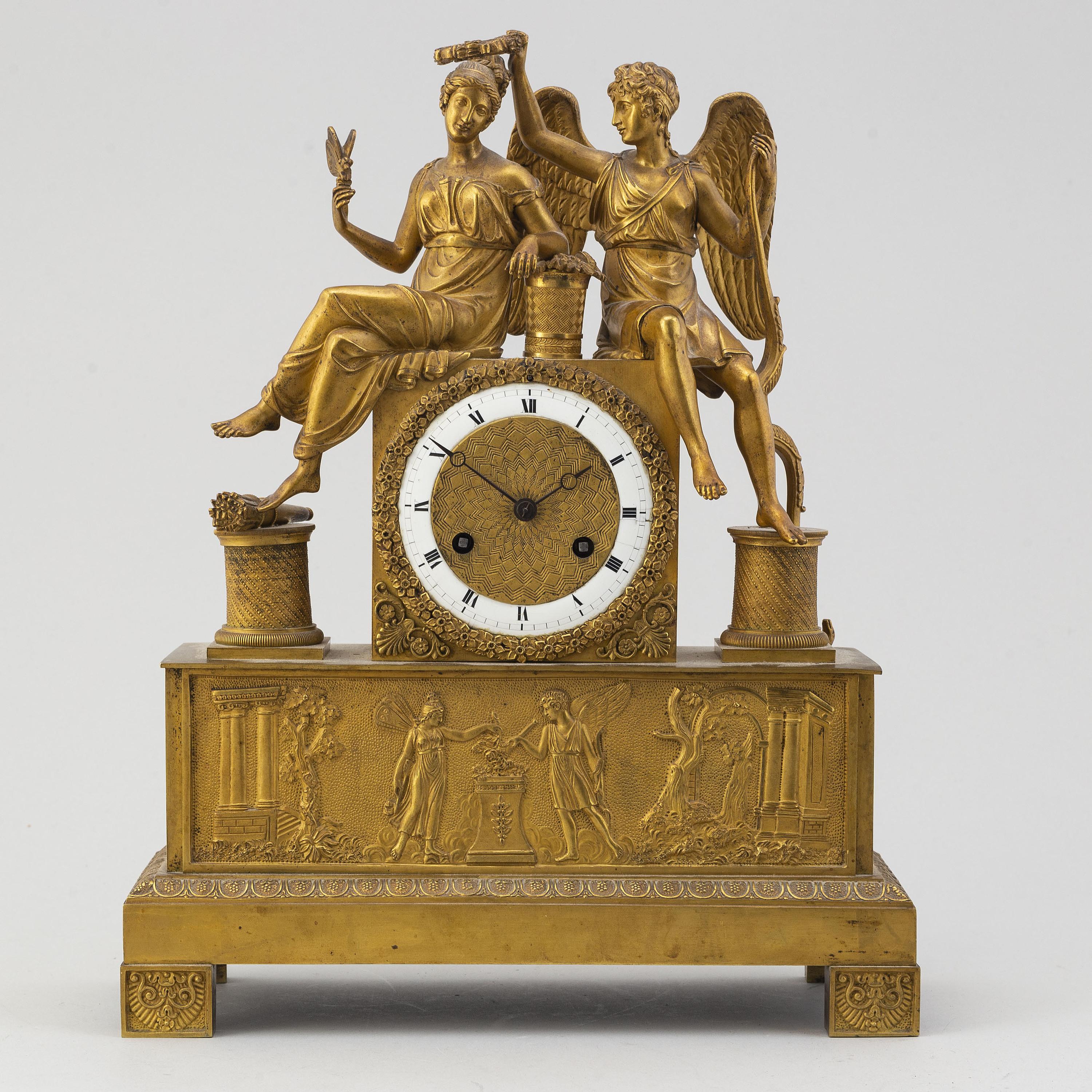 A French Empire table clock, first half of the 19th century.
Measures: Width 30, depth 11, height 38 cm. Key included.
Later added hatch at back. Function not tested but can restored or inspected by clock specialist upon request and for additional