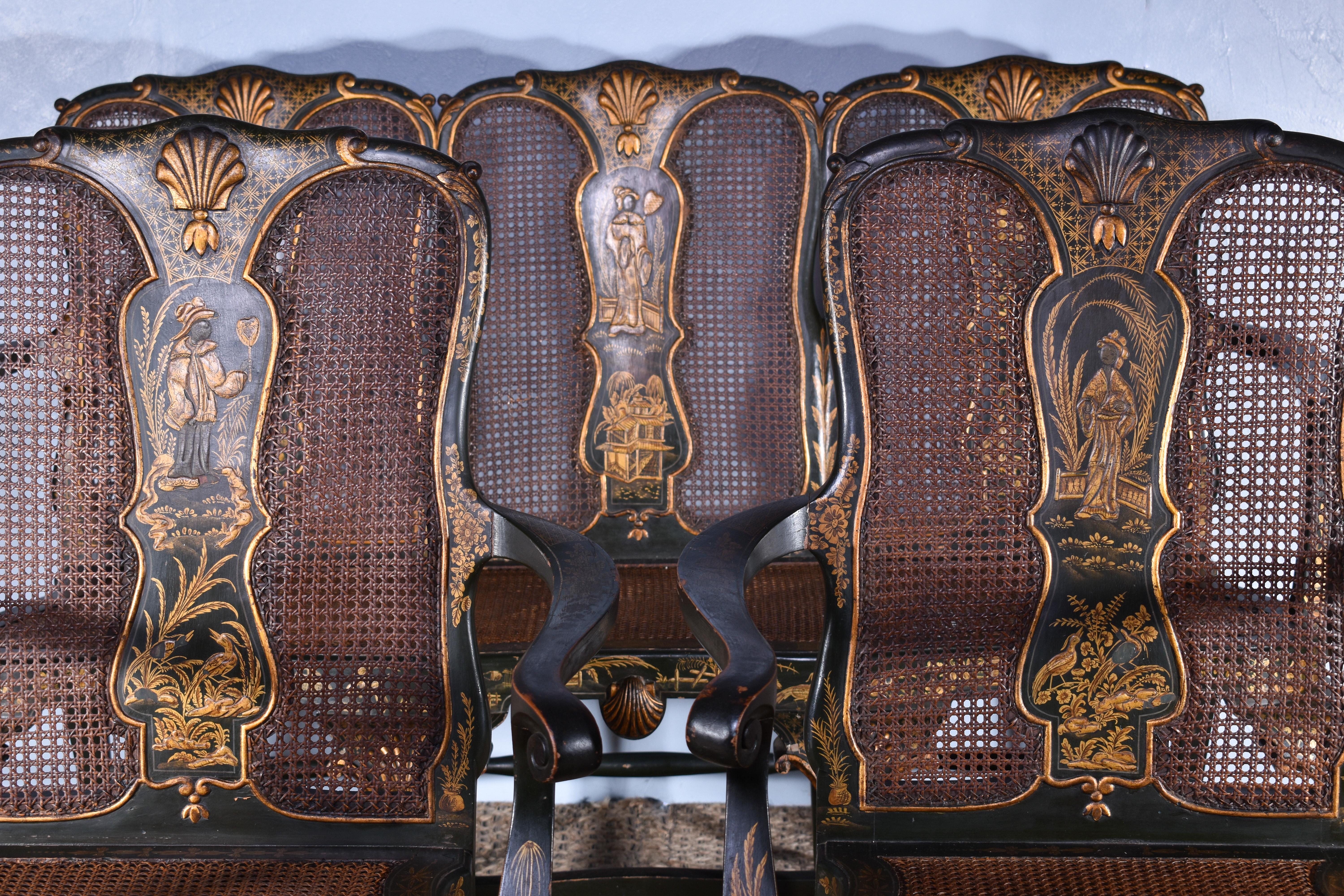 A superb gilt and green japanned suite, comprising of a three seater settee and a pair of armchairs.

Early twentieth century, in George II style.

The gilt chinoiserie decoration displaying figures and flowers, with fine original cane backs and