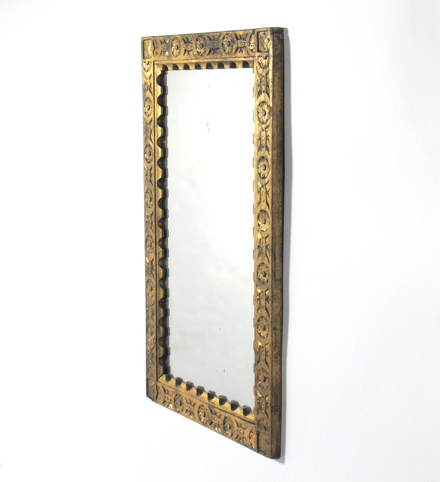 Gilt hand carved Spanish or Italian mirror, at least 1930s, possibly much earlier. Retains wonderful original distressed patina to both the giltwood frame and the mirror.