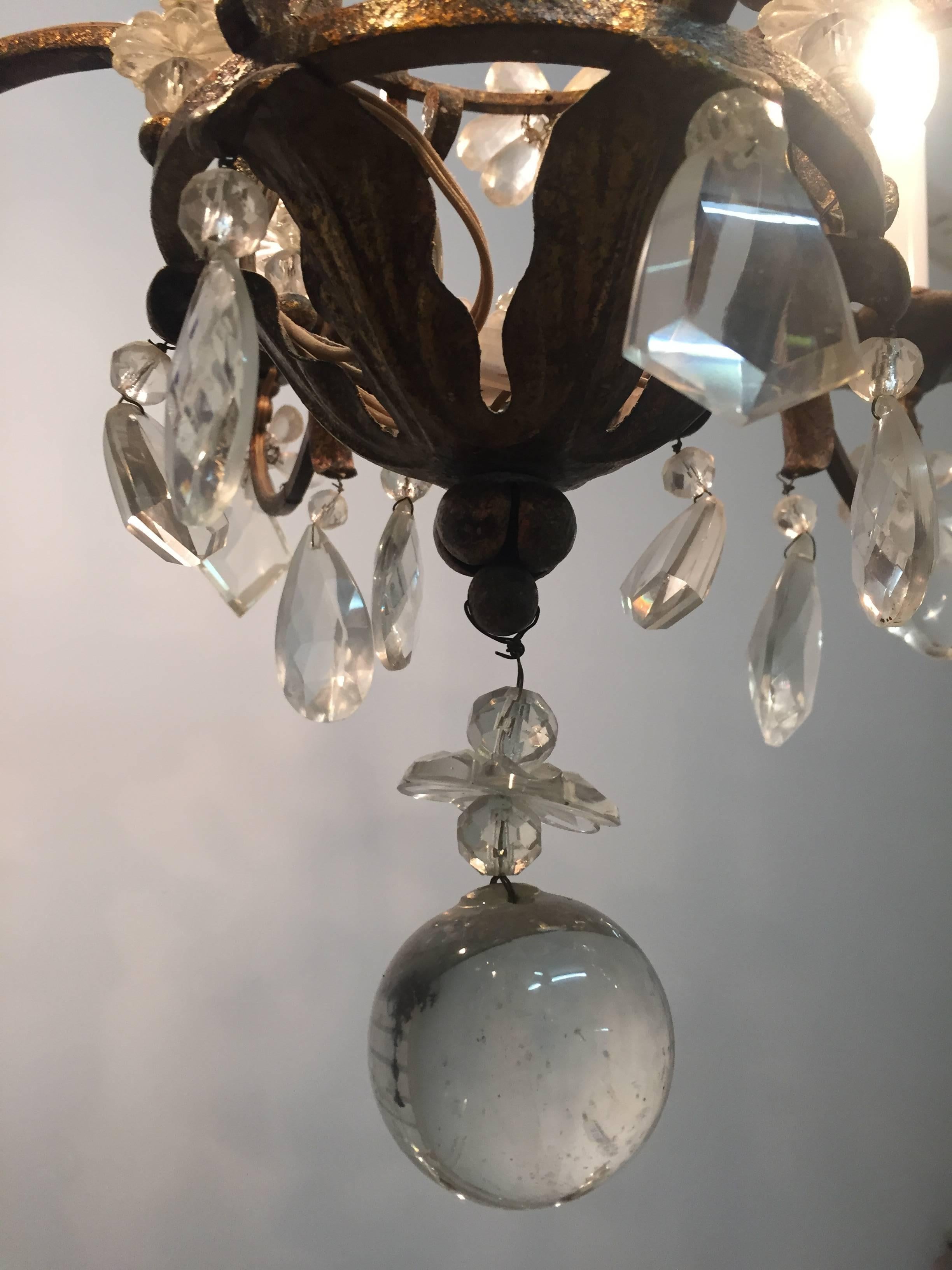 Mid-20th Century Gilt Iron and Crystal Chandelier in the Style of Maison Baguès, France, 1940s