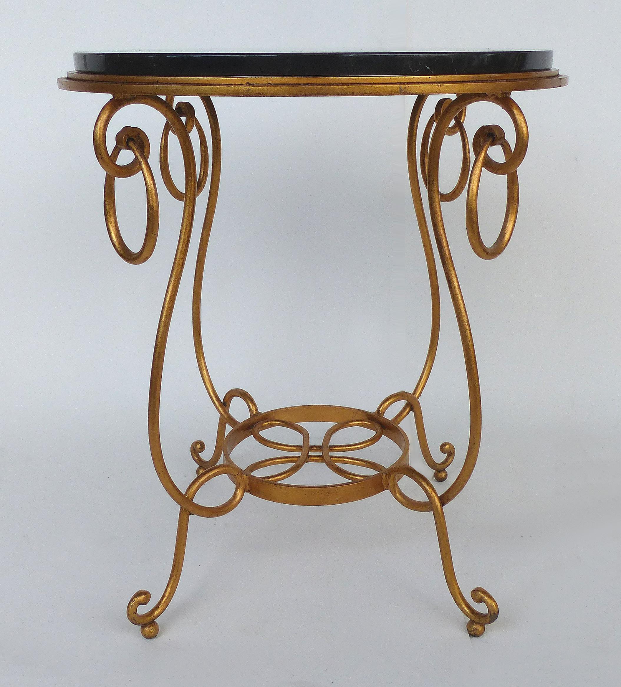 Gilt Iron and Marble Occasional Table

Offered for sale is a gilt wrought iron occasional table fitted with a thick round black marble top. The table has a delicate feel with lovely curves even though the materials are substantial.