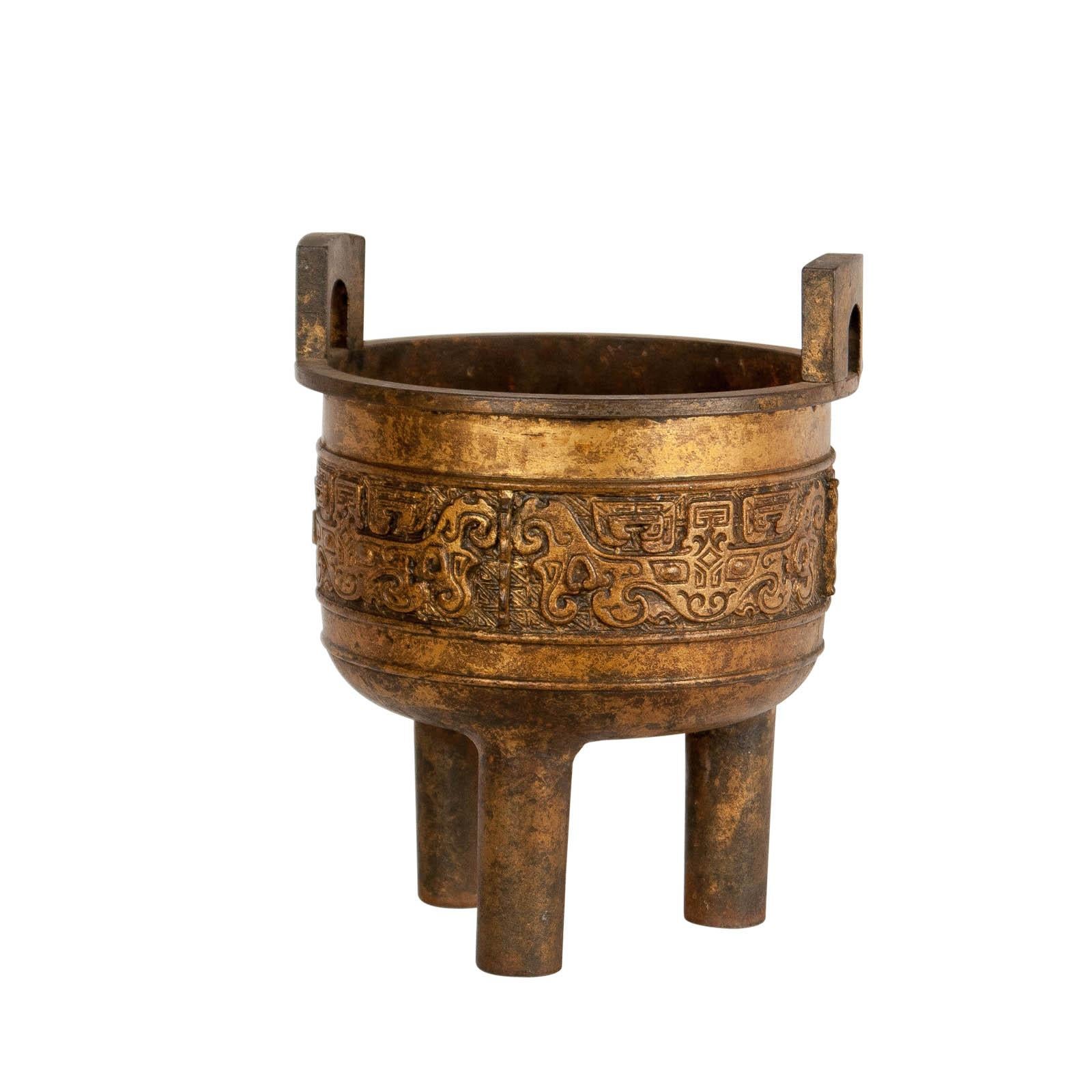 A Chinese ding or censer in the Archaic style made of iron with gilding, circa 1900.