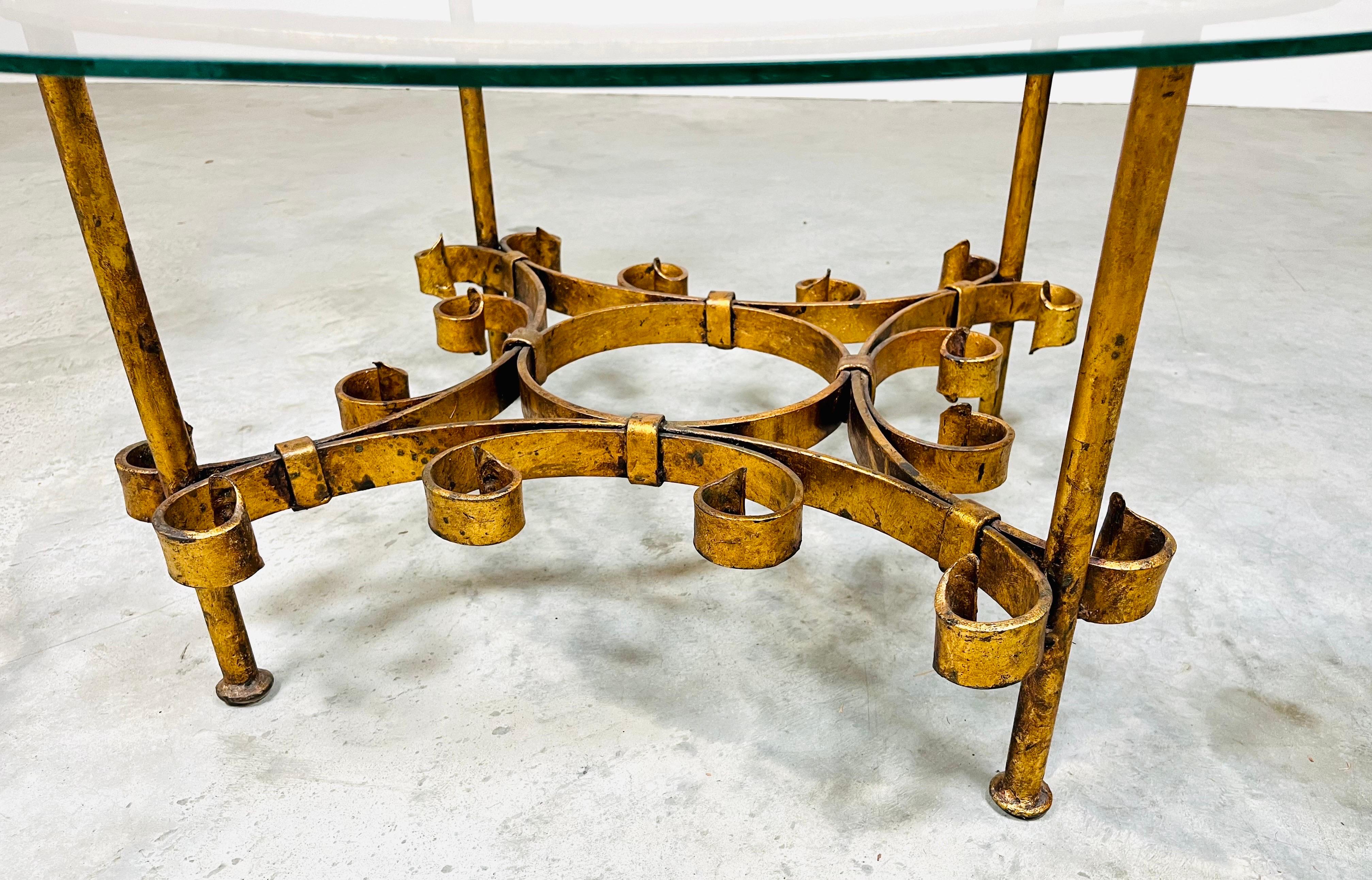 Hand forged iron parcel-gilt cocktail table with original 1/4