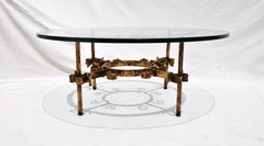 Table basse/table à queue de cheval en fer doré à la manière de Gilbert Poillerat