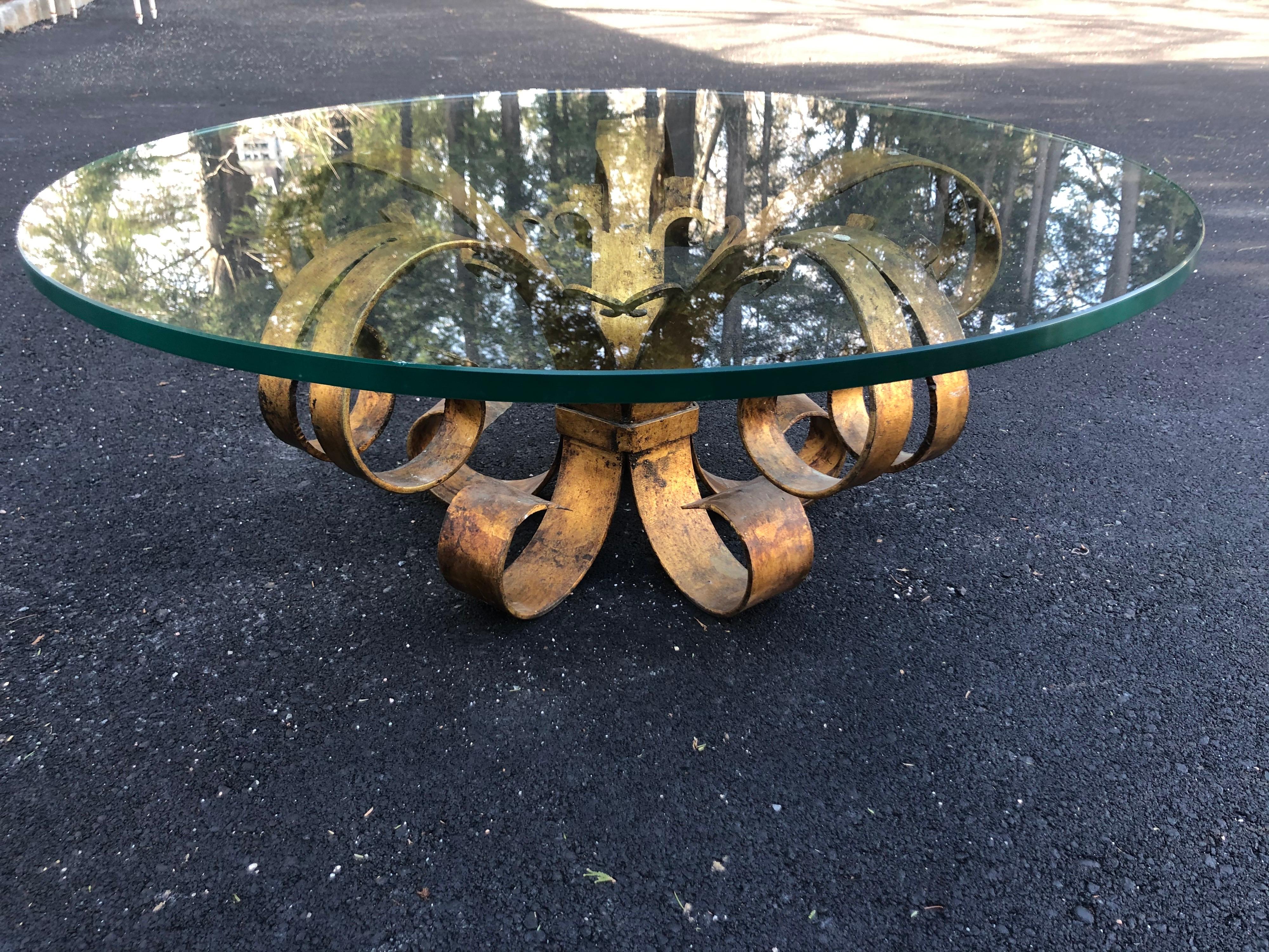 Gilt Iron coffee Lotus table with round glass top. Beautiful designer piece with a 3/4