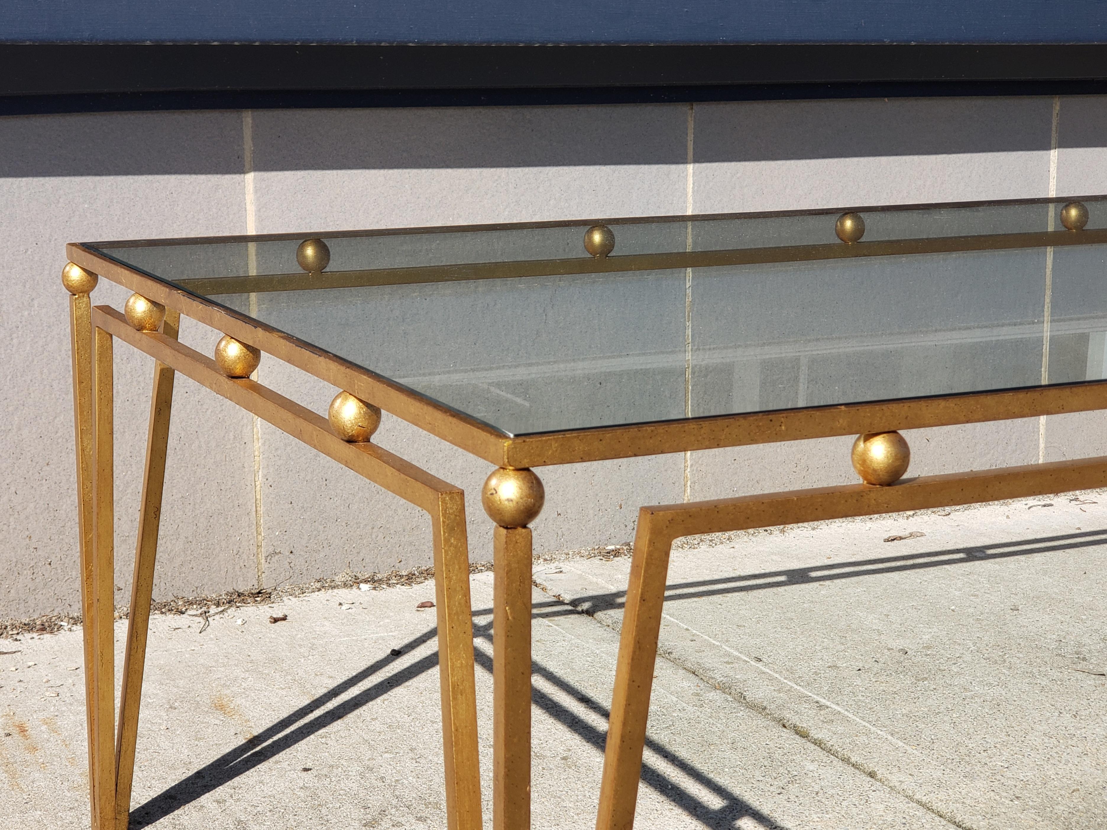 Stunning gilt iron coffee table after Marc du Plantier. Wonderful size and versatile lending itself to both modern and traditional interiors.