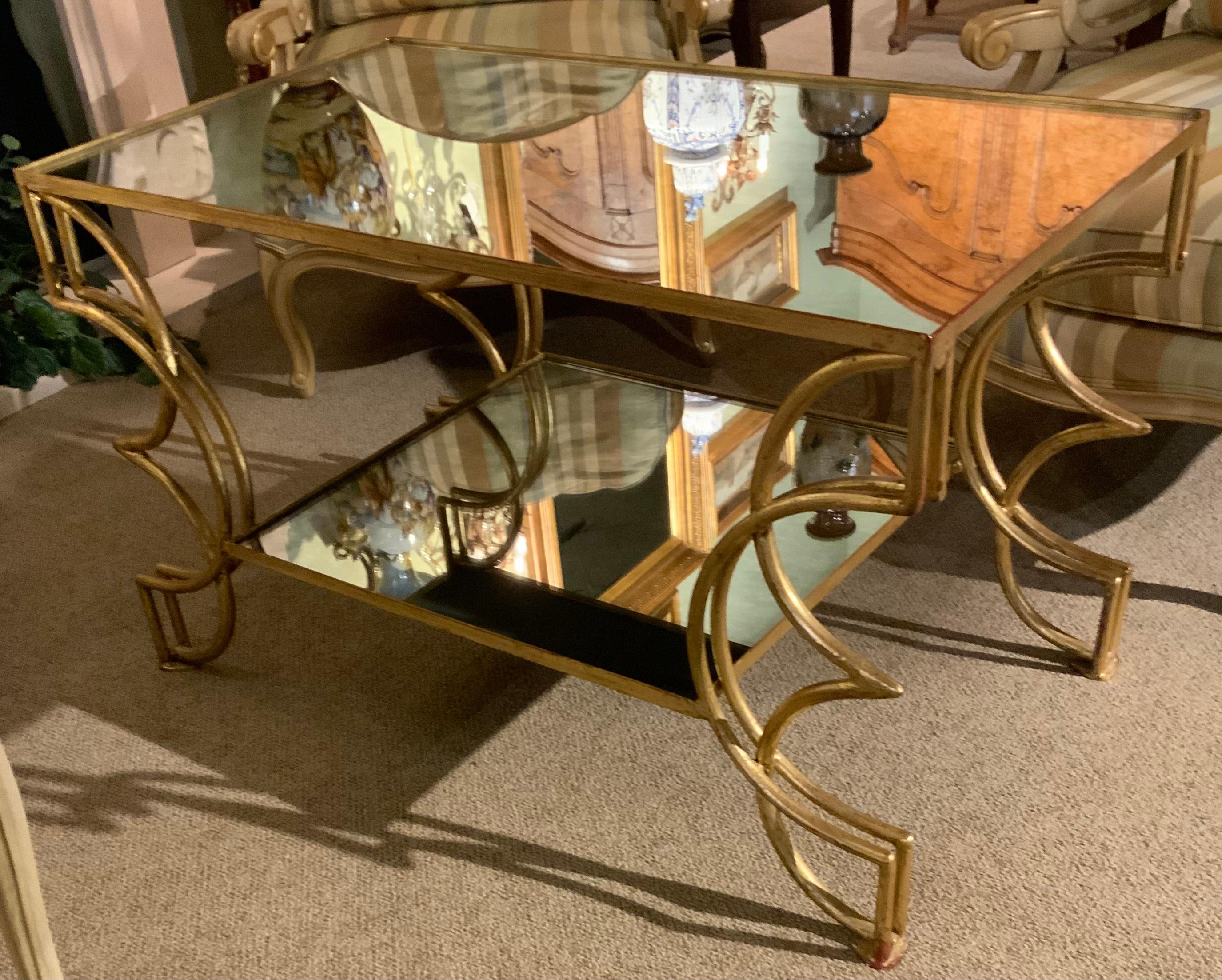 The gilt finish to the metal framework is very attractive showing a bit of
red through the outer color making it a very artistic affect. The mirror is
a smoked finish on both levels which is extremely affective. The framework 
is scrolling in a