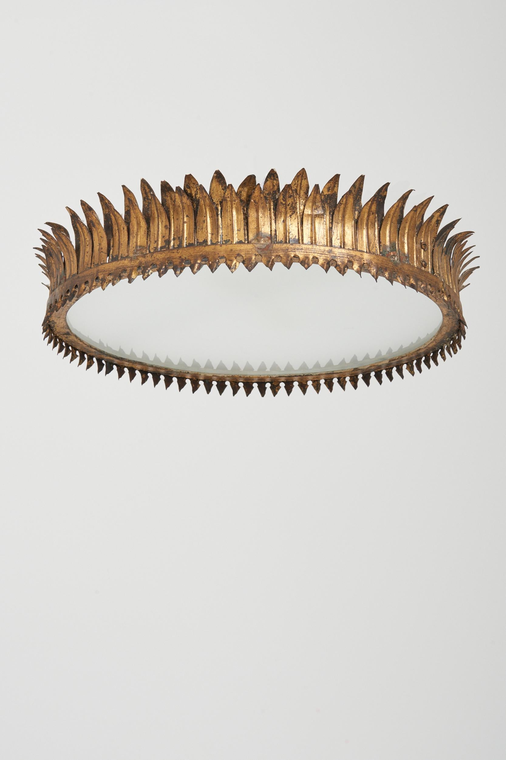 A gilt iron crown shaped flush ceiling light
Spain, mid-20th century.