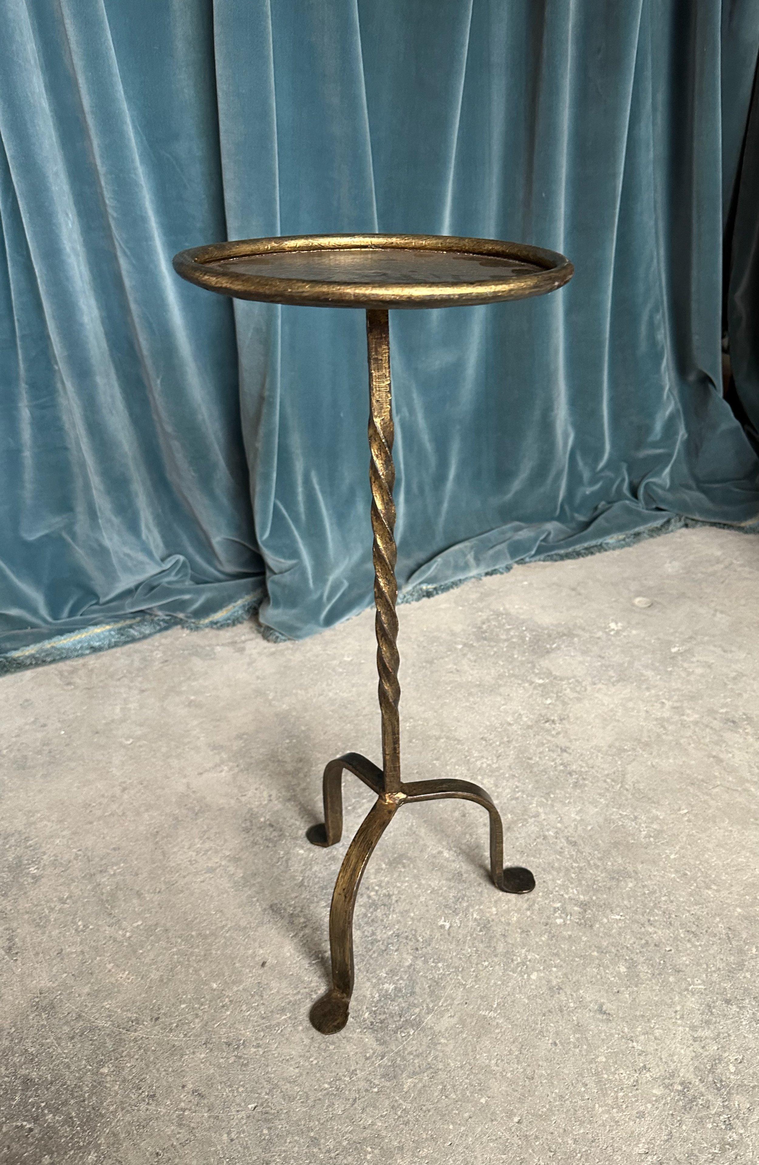 A handsome Spanish gilt iron drinks table, recently crafted to our design and specifications that features a twisted stem design mounted on a sturdy tripod base, creating an aesthetically pleasing silhouette. Recently made by European artisans using