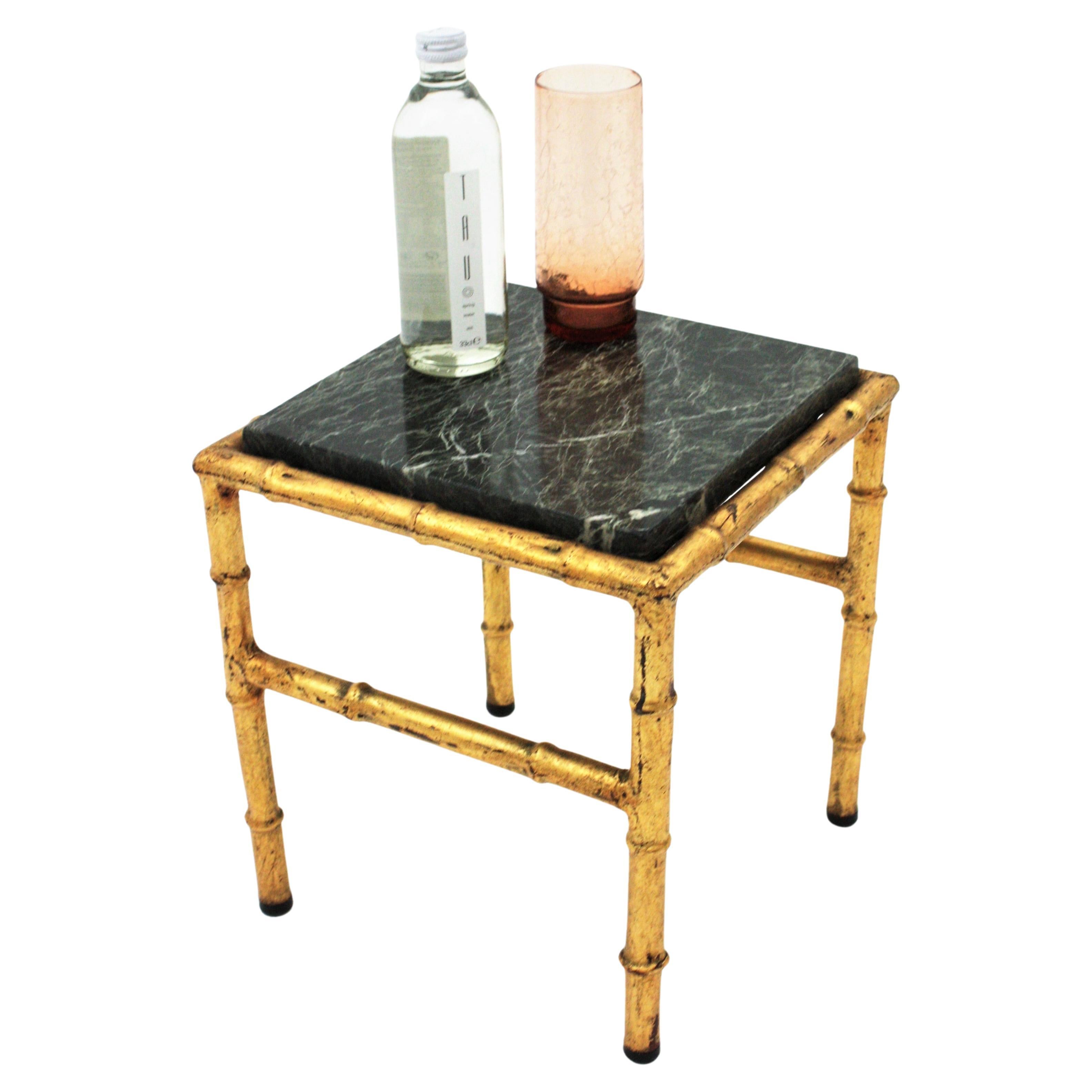 Elegant gold leaf gilt iron faux bamboo side table with green marble top, France, 1940s.
This lovely low table has a clean design featuring an iron faux bamboo structure finished in gold leaf and a green marble top with white veins.
It will be a