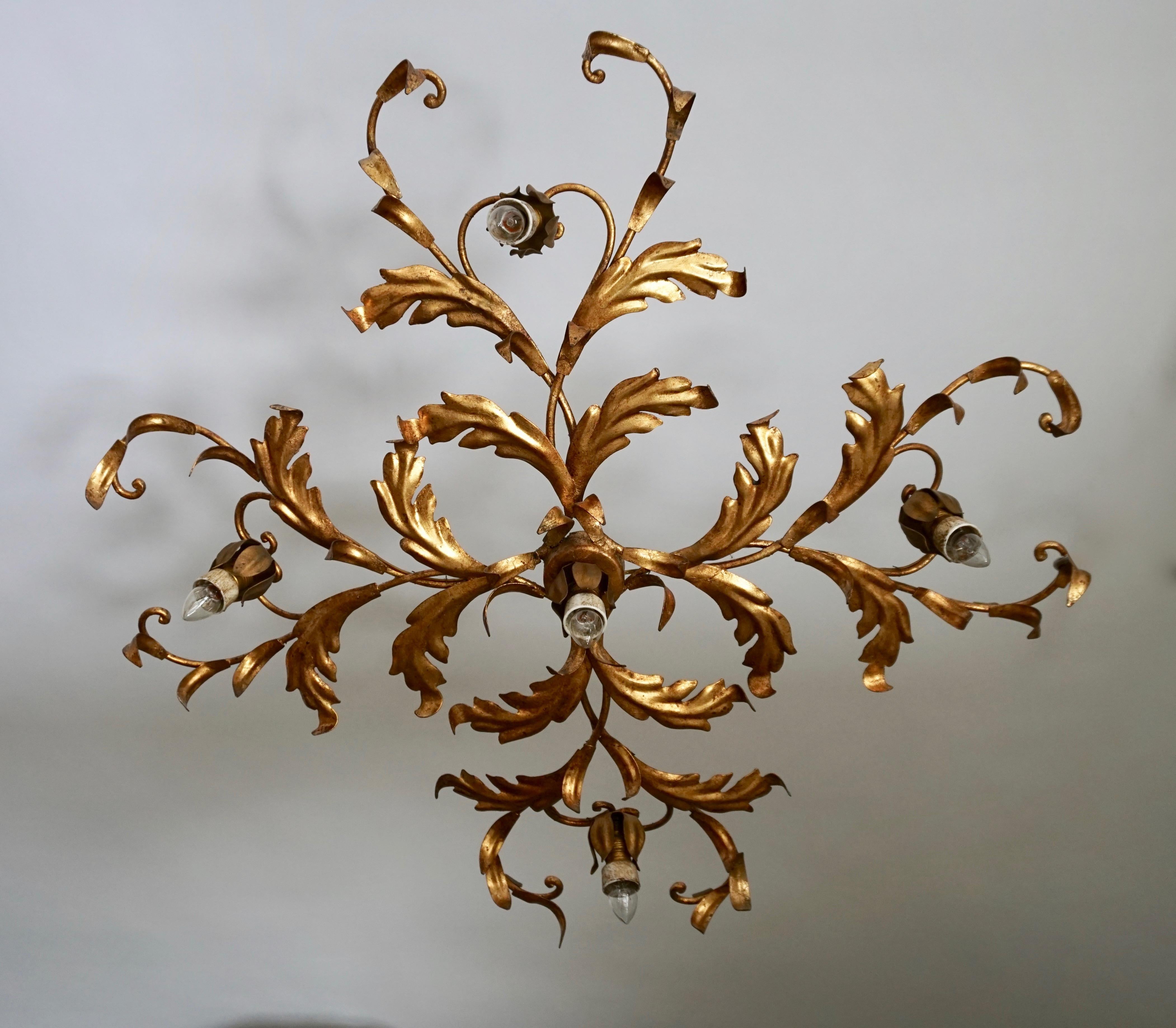Elegant large Hollywood Regency flush mount or sconce with a gilt metal frame. Fixture has 5 E14 light sources.
Flush mount body measures 24 inches in diameter x 5.9 inches tall. 

Measures; Diameter 63 cm.
Depth 15 cm.