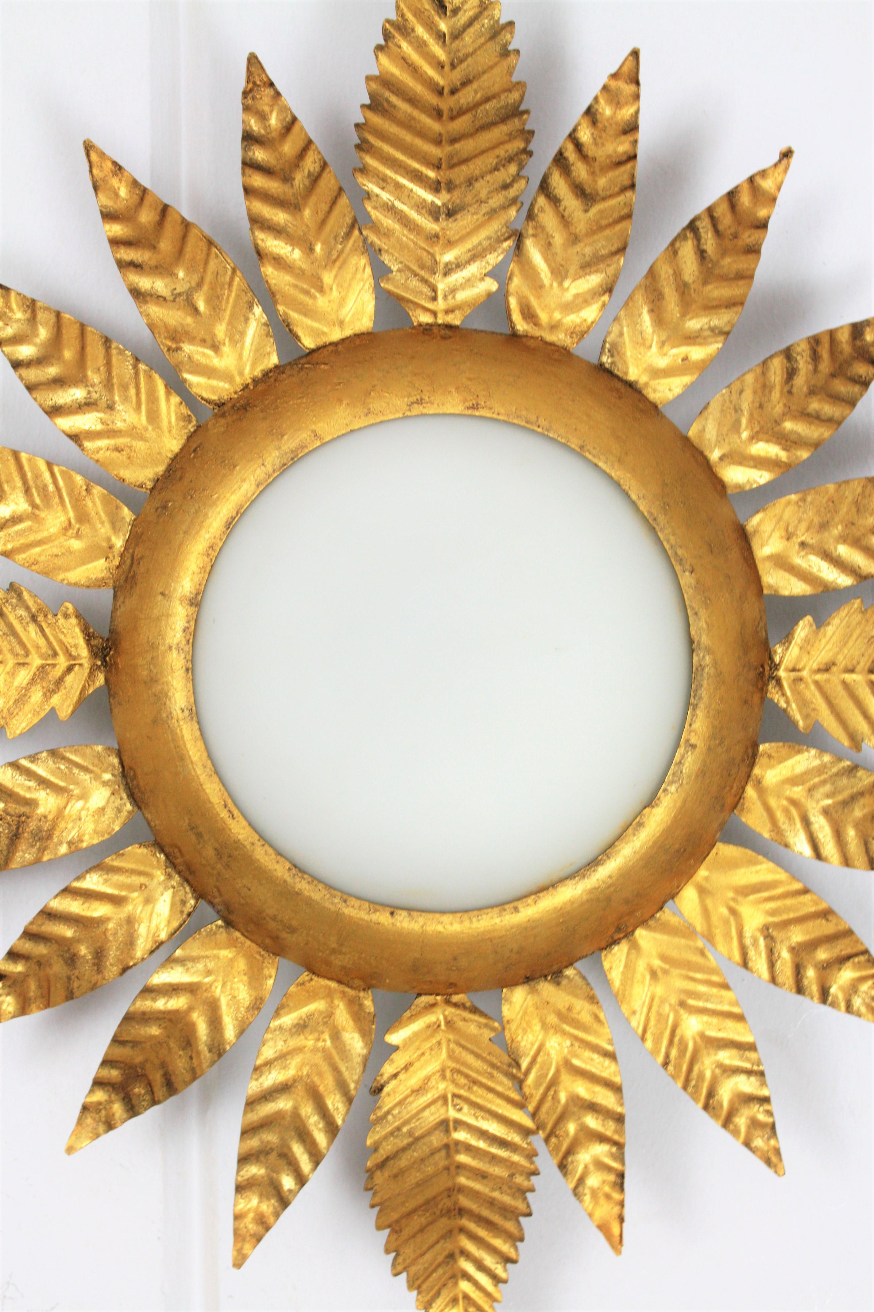 Hollywood Regency Gilt Iron Sunburst Leafed Light Fixture with Milk Glass Shade, France, 1950s 