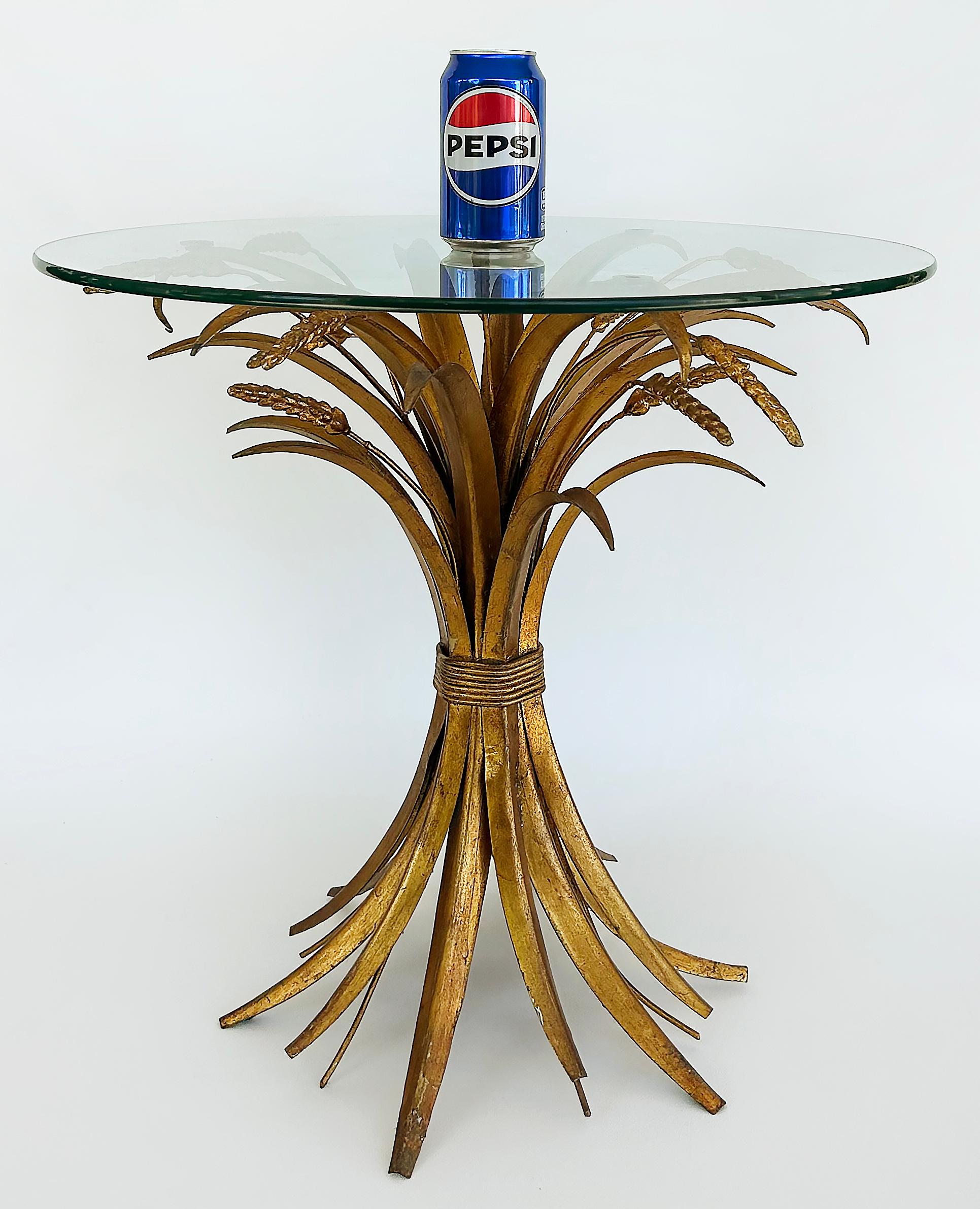 Gilt Iron Sheaf of Wheat Coco Chanel Side Drinks Table, Italy 1970s

Offered for sale is an Italian sheaf of wheat glass top side or drinks table dating to the late 20th century. The table is often referred to as the Coco Chanel table because