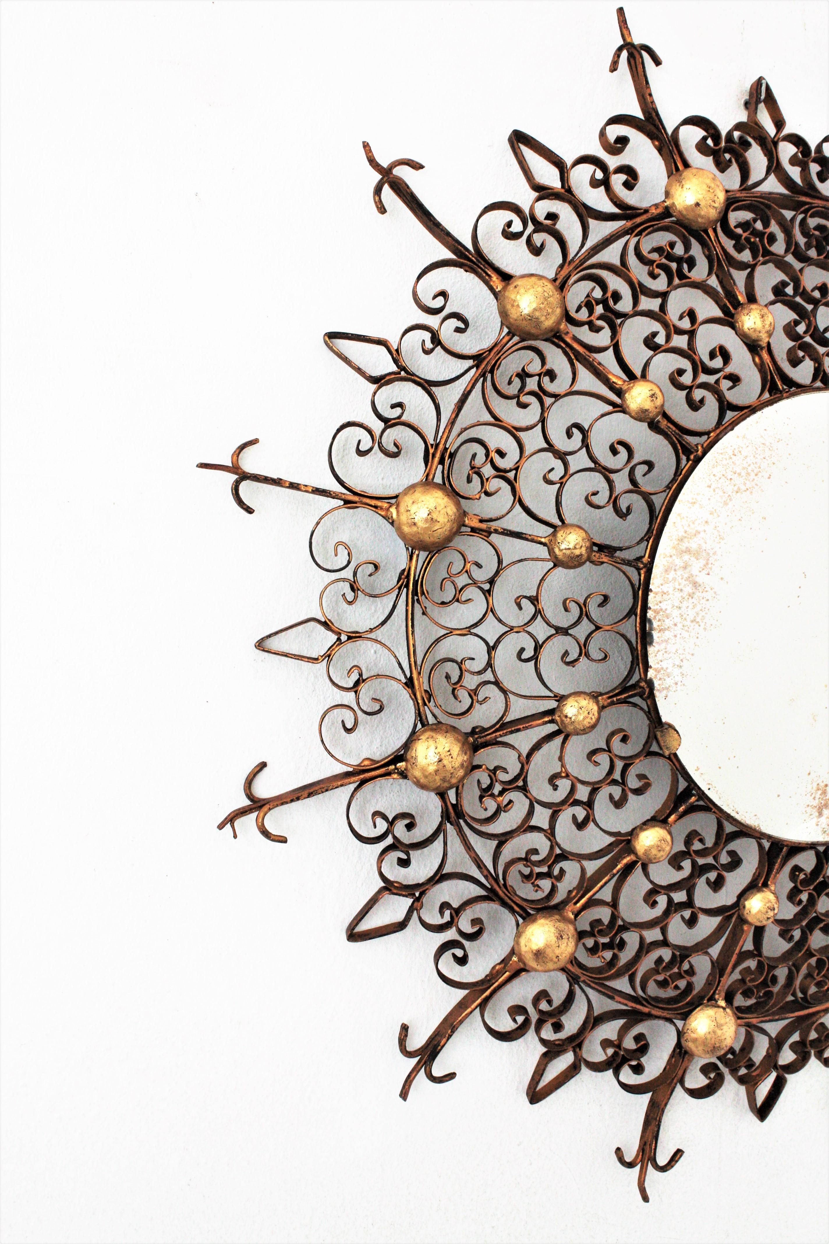 Gold Leaf Scrollwork Sunburst Mirror / Backlit Mirror with Convex Glass, 1940s For Sale