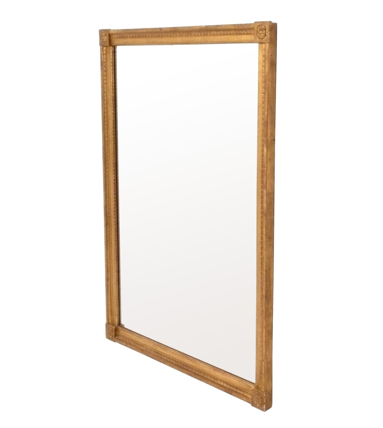 Gilt Italian mirror, recently removed from the famed Carlyle hotel in NYC, originally from Italy, circa 1960s. It retains its original warm patina to both the gilt wood frame and the original mirror.