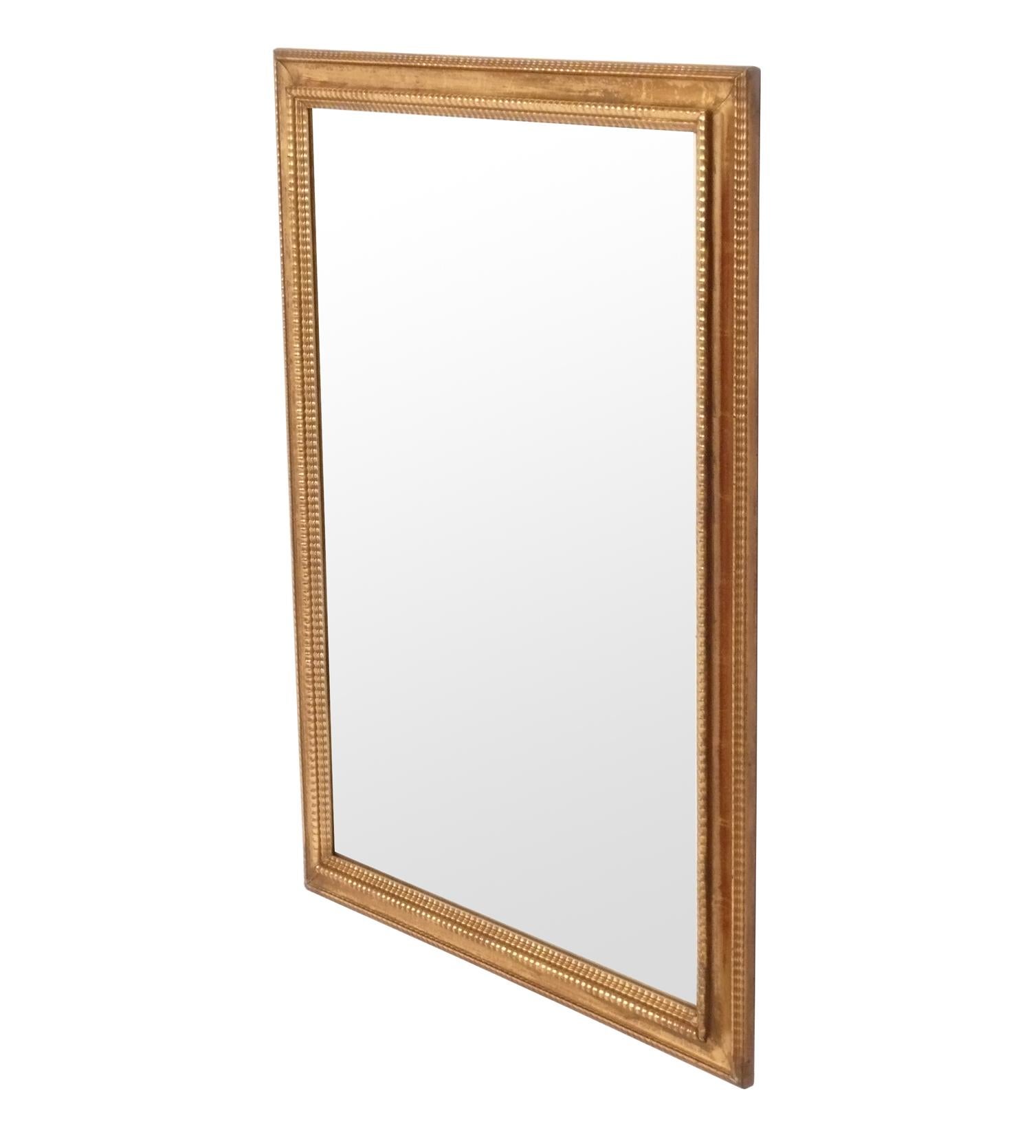 Gilt Italian mirror, recently removed from the famed Carlyle Hotel in NYC, originally from Italy, circa 1960s. It retains its original warm patina to both the gilt wood frame and the original mirror. Very good original condition with distressed