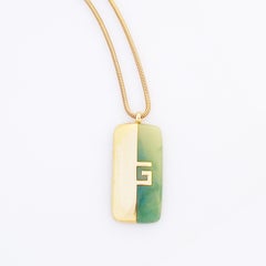 Gilt & Jade Lucite Logo Pendant Necklace By Givenchy, 1970s