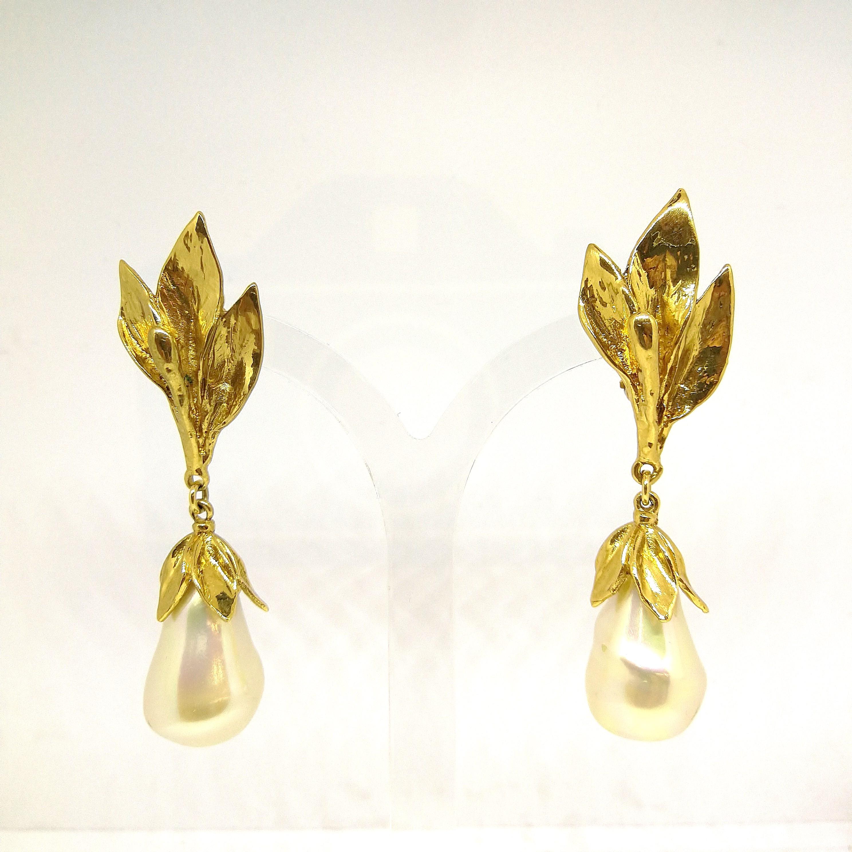 Iconic and classic drop earrings, with gilt metal leaves , in a rich gold plating, made by Maison Goossens for Yves Saint Laurent, most likely designed by Loulou De La Falaise. A wonderfully wearable pair of earrings suitable for many occassions,