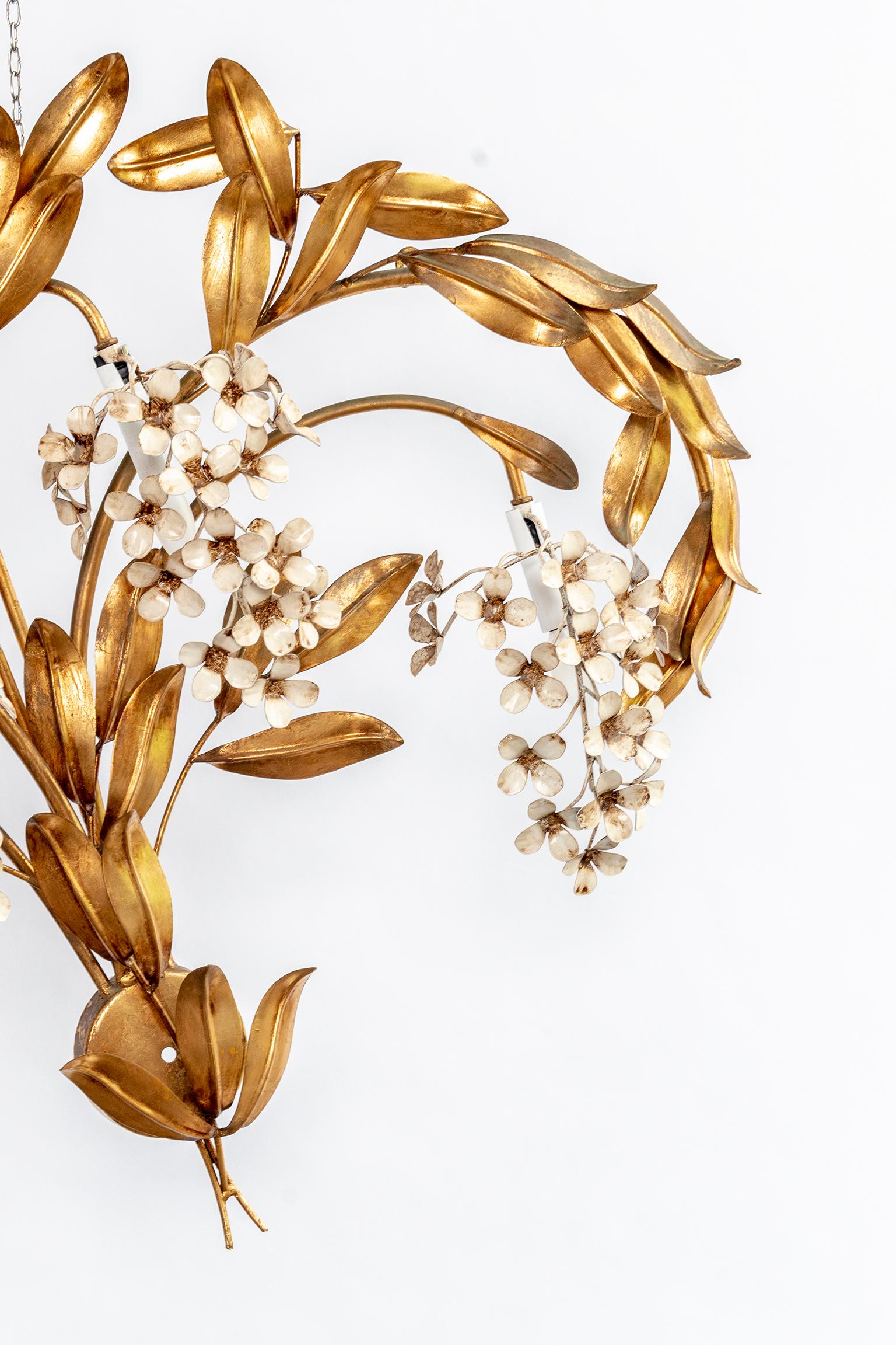 Gilt leaves and white flower appliques with four lights each. Sold separately. Wired for US.