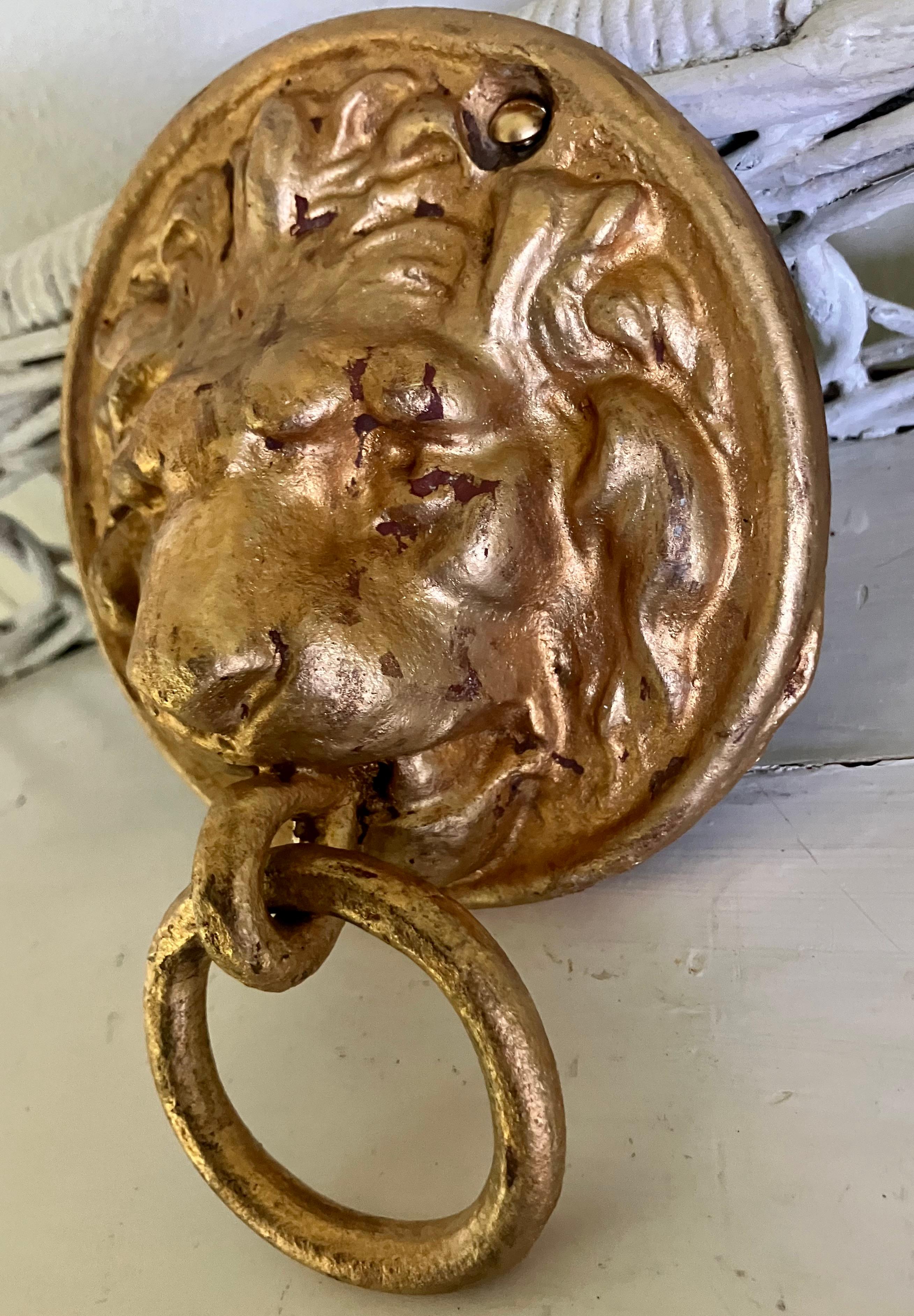 Gilt lion ring handled bridle hitch. Antique metal lion ring handle mask for hitching horses. American 19th century 

Dimensions: 4.75