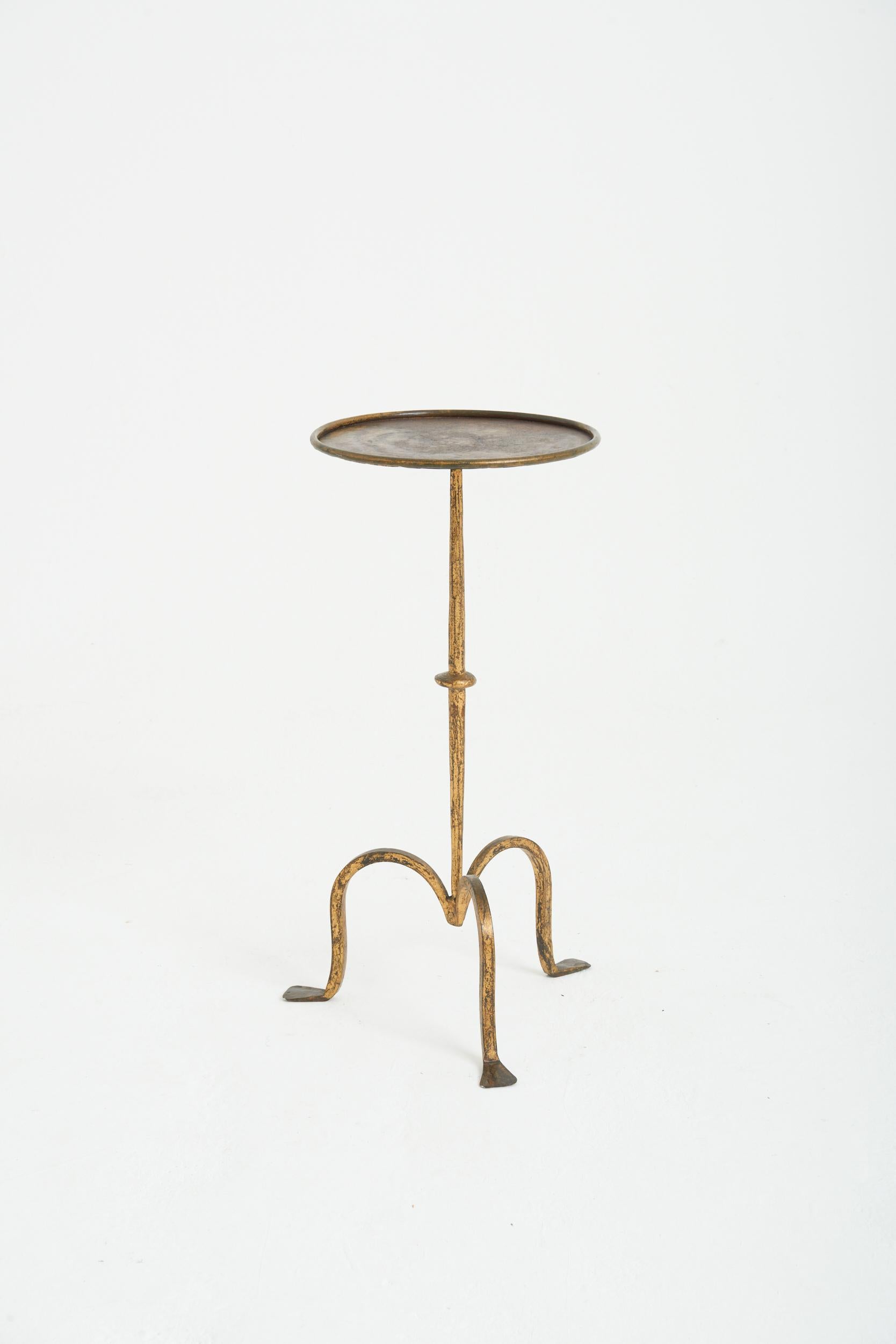 A gilt wrought iron martini table.
Spain, mid 20th Century
55 cm high by 26 cm diameter
