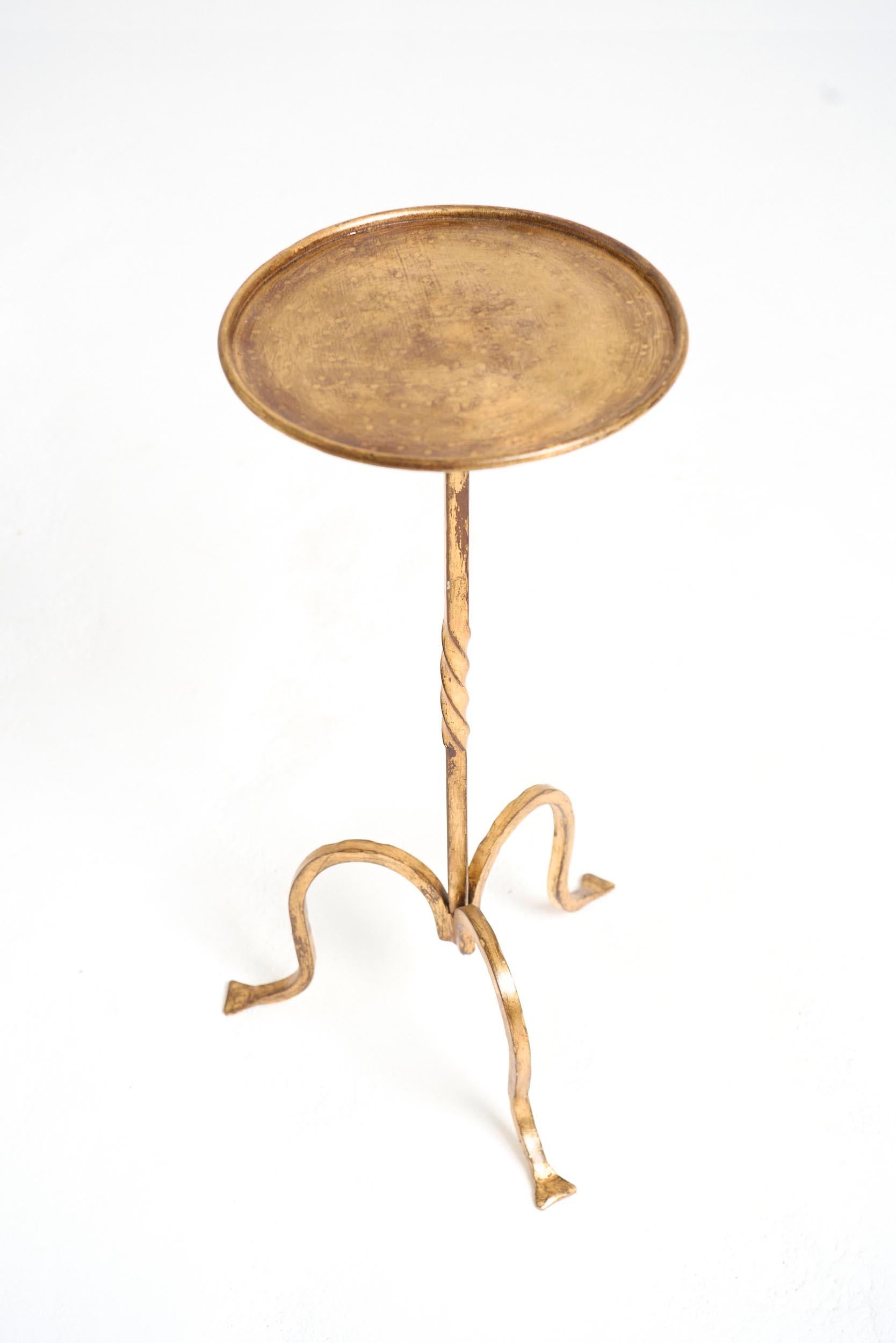 A gilt wrought iron martini table
Spain, mid 20th Century
