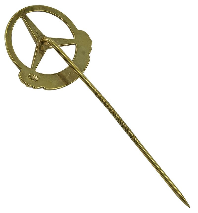 Spilla a bastone in metallo dorato con il logo 