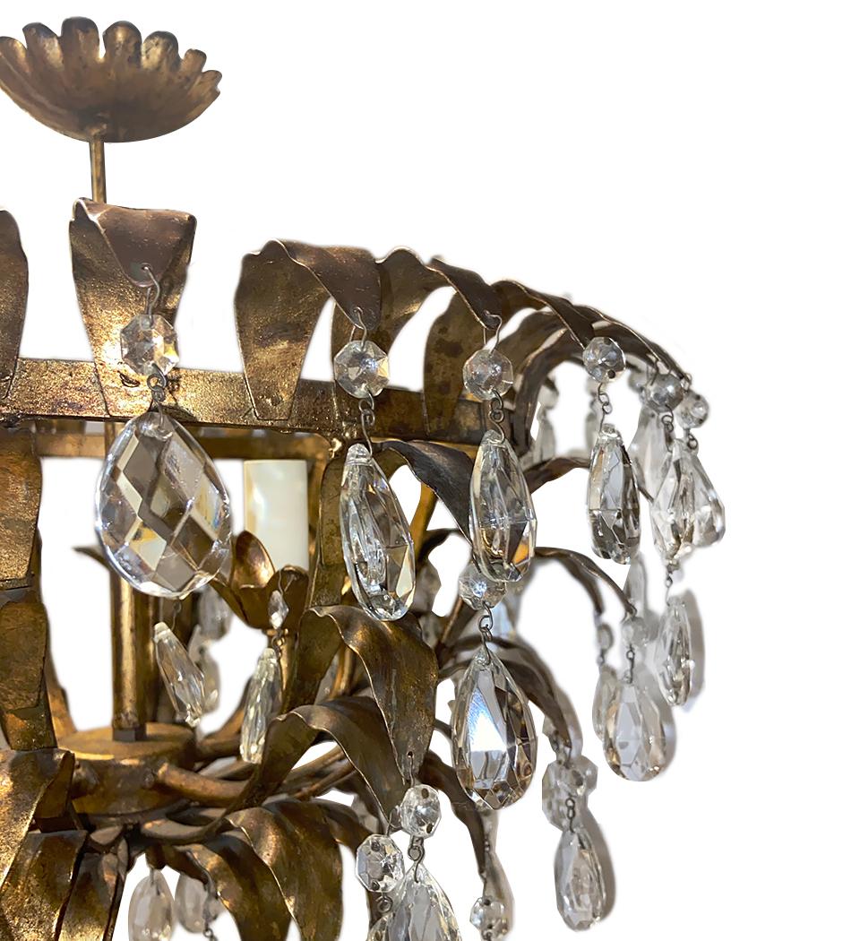 A circa 1940's Italian gilt metal and crystal drop light fixture with five interior lights.

Measurements
Height: 20