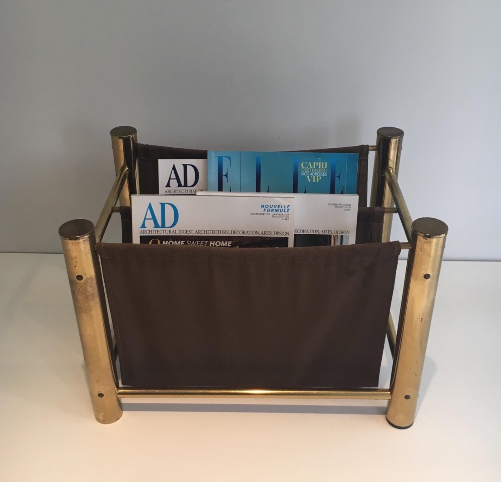 This magazine rack is made of gilt metal and fabric. This is a French work. Circa 1970
