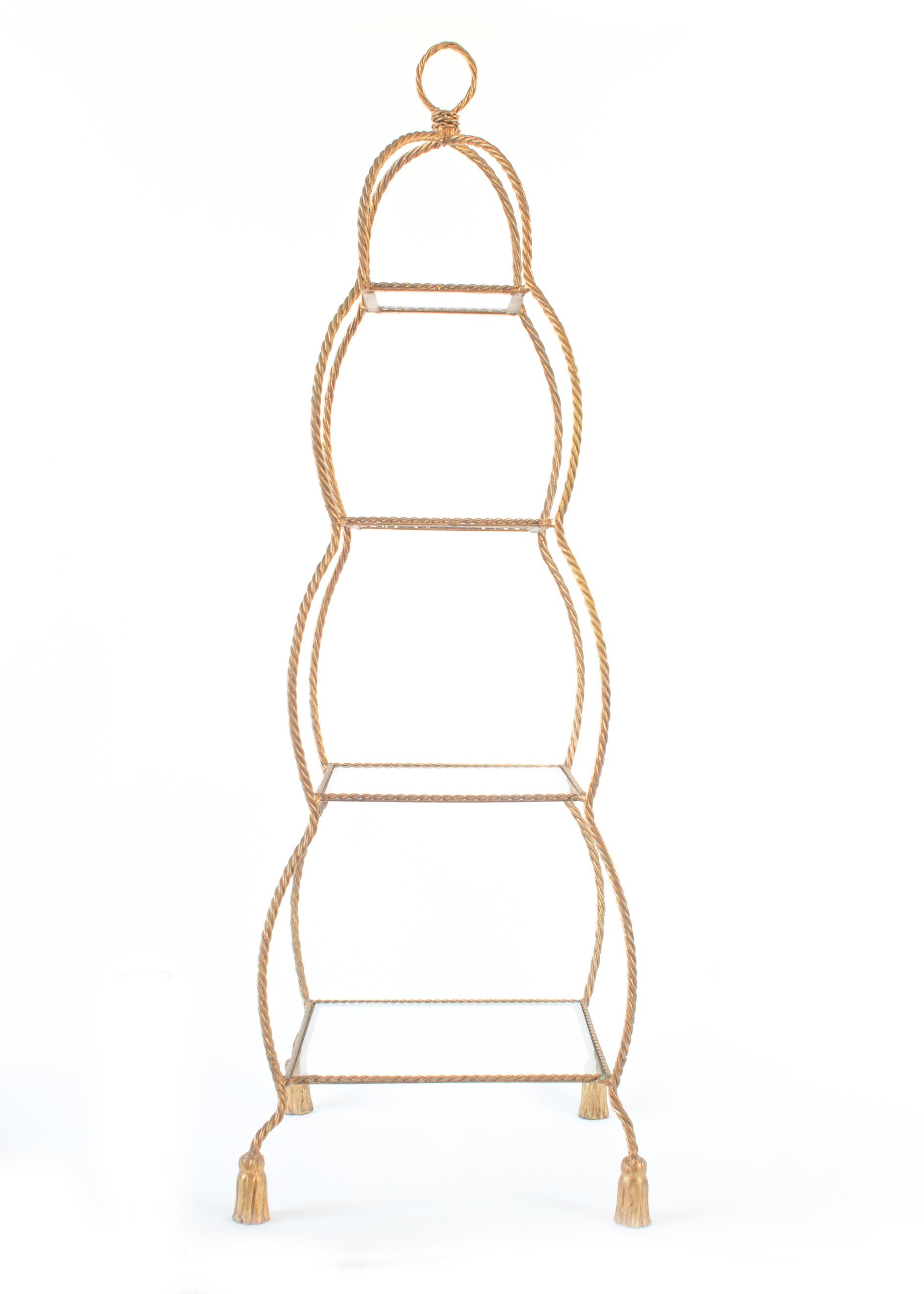 Étagère comprised of four square glass shelves framed within a gilt metal rope and tassel, billowing-form design.